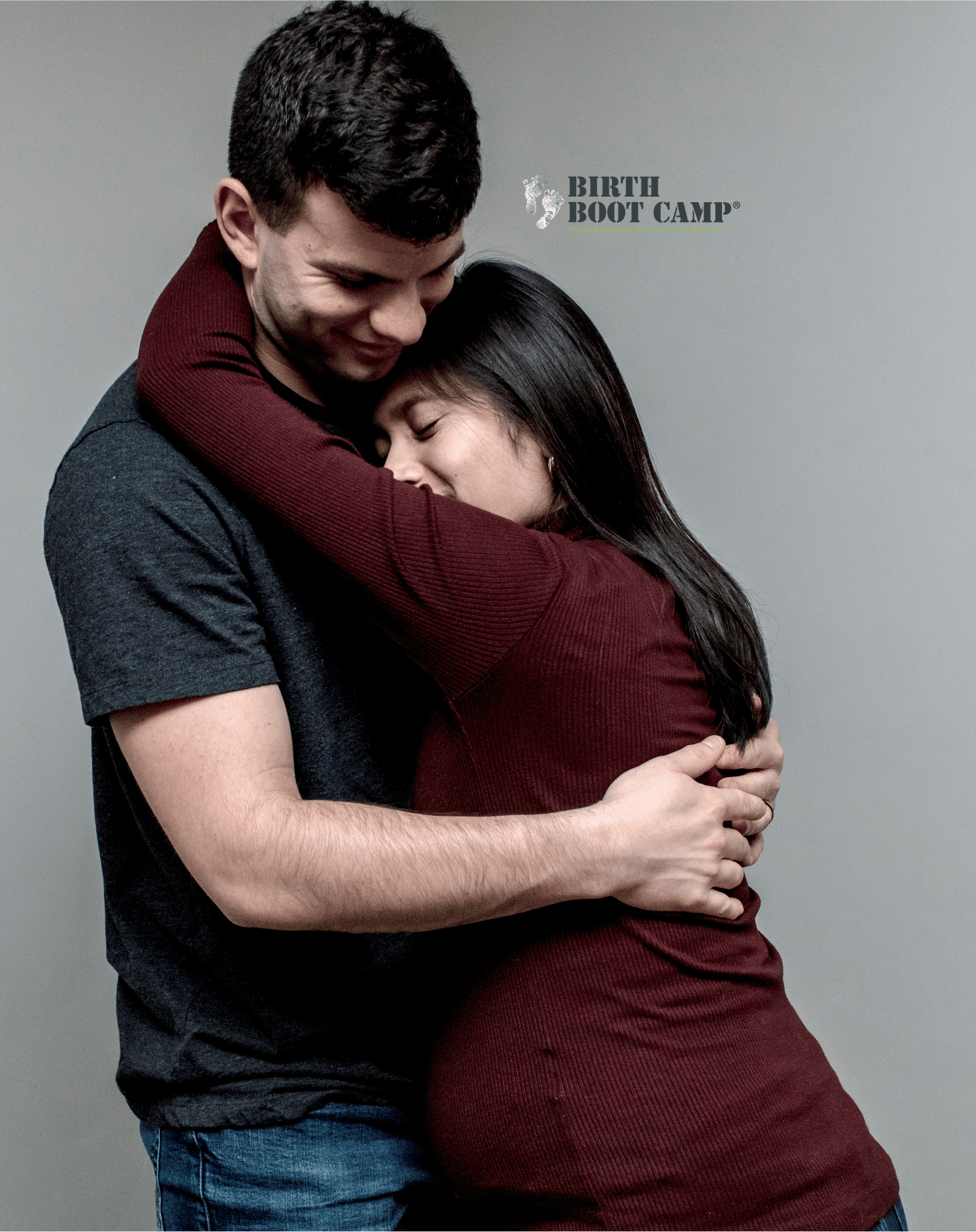 A man and woman hugging each other, smiling, against a plain background, with some text that reads 'Birth Boot Camp' and a tagline.