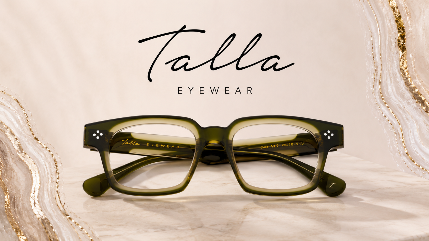 Green eyeglasses with black accents displayed on a marble surface, with a backdrop featuring the logo 'Talla Eyewear' and a decorative gold and white marble pattern.