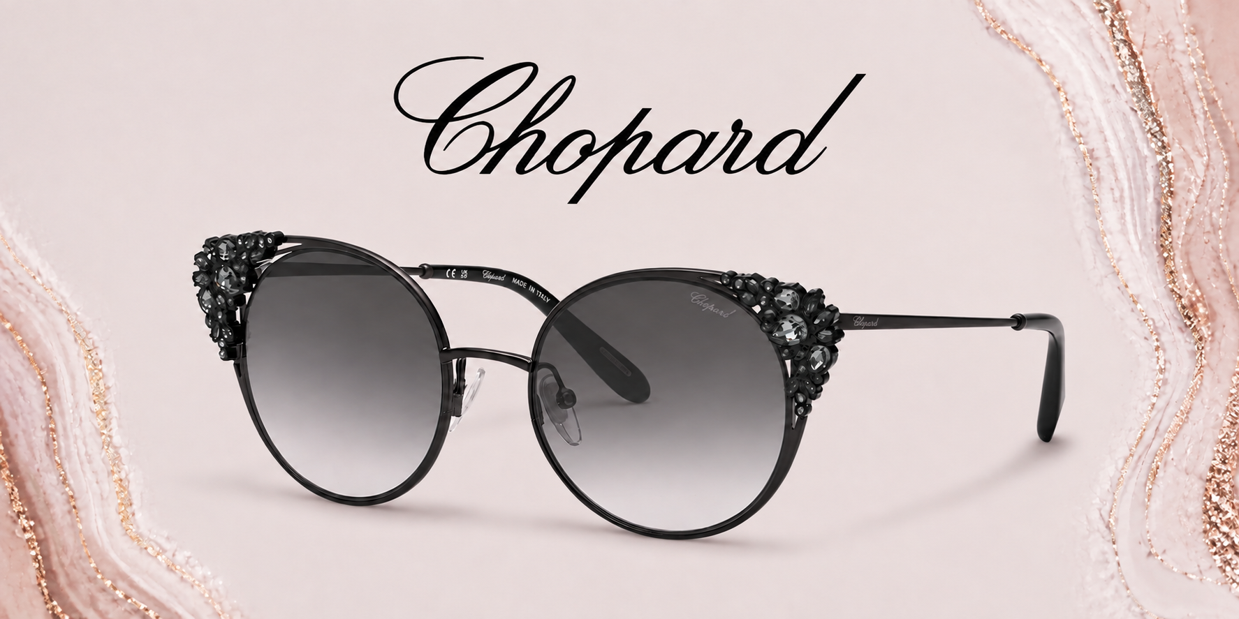 Designer black sunglasses with decorative embellishments on the frames, placed against a pink and gold textured background with the brand name 'Chopard' written above.