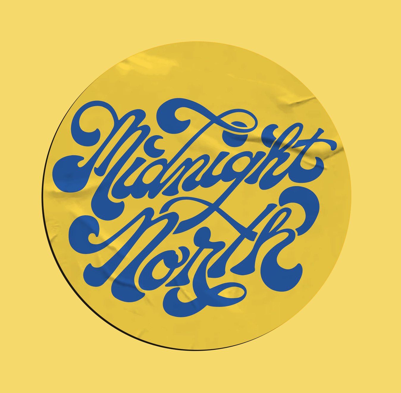 Yellow circular sticker with blue cursive text that reads 'Midnight North'