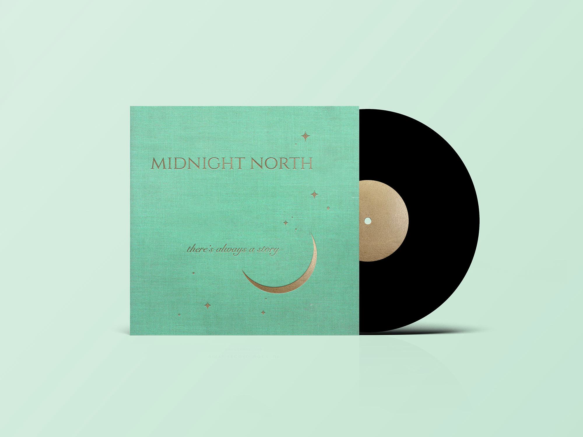 A black vinyl record partially behind a teal-colored album cover titled 'Midnight North' with a crescent moon and stars on the cover, placed on a light green background.