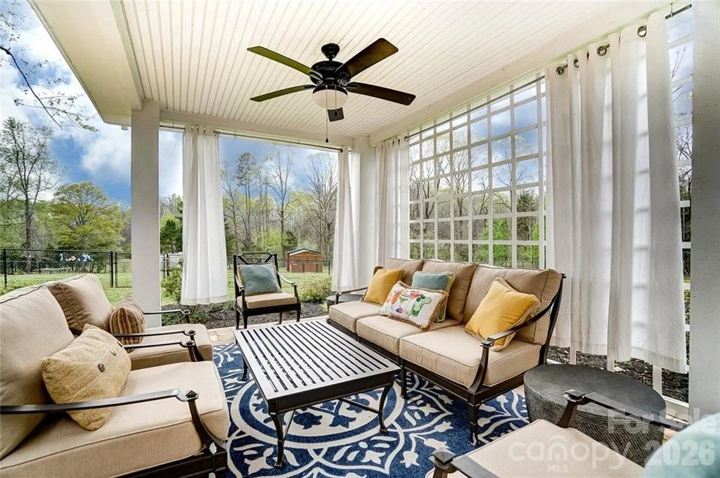 Outdoor patio interior with large windows in a Charlotte Metro residential home listed by top SC and NC Realtor Penny Sheppard