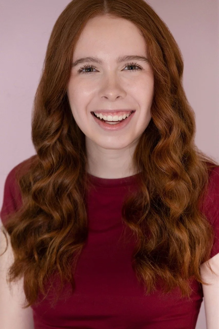 Kassia in a red shirt, very happy