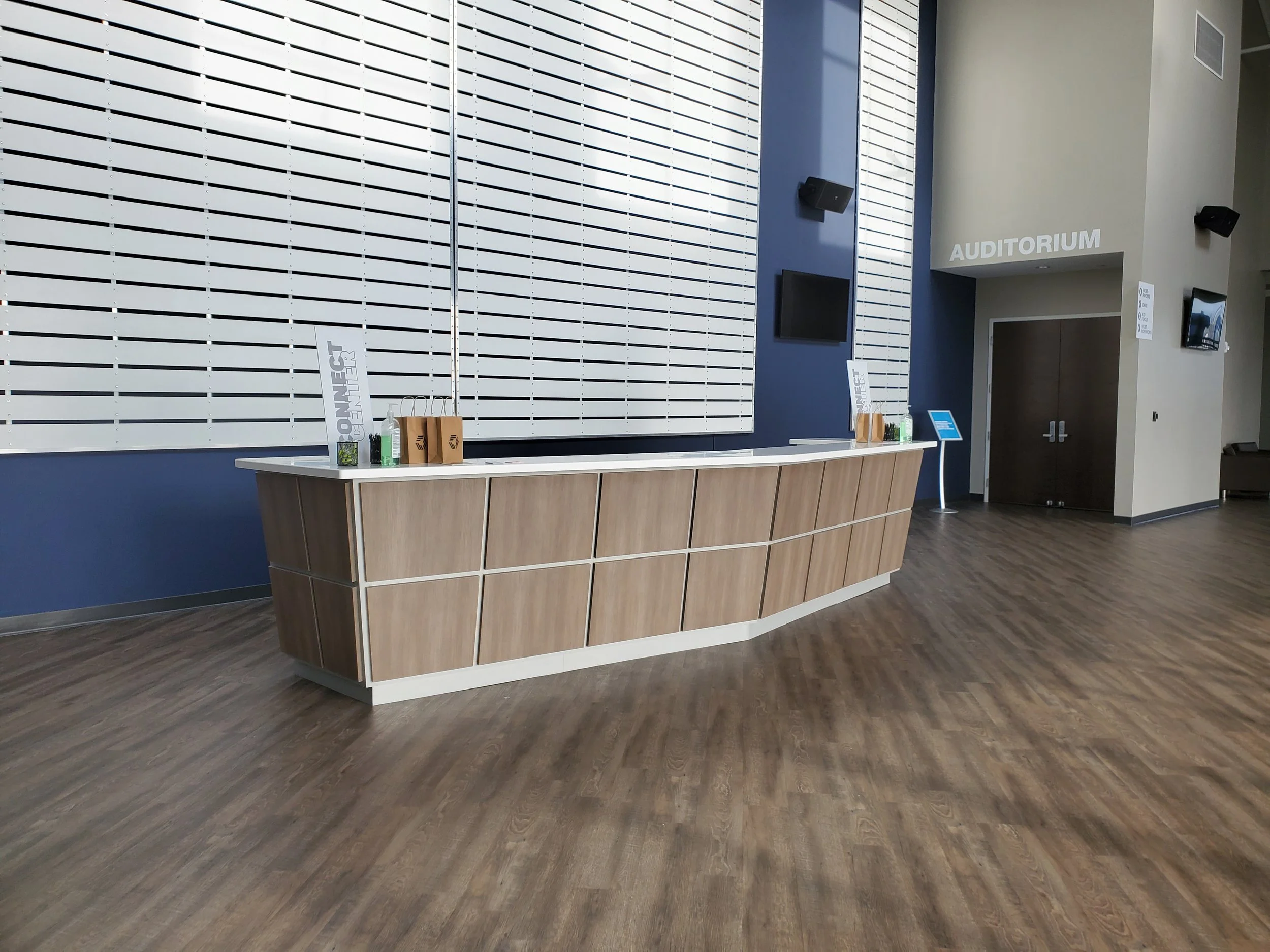 Modern custom built reception desk in a commercial auditorium in a large church.