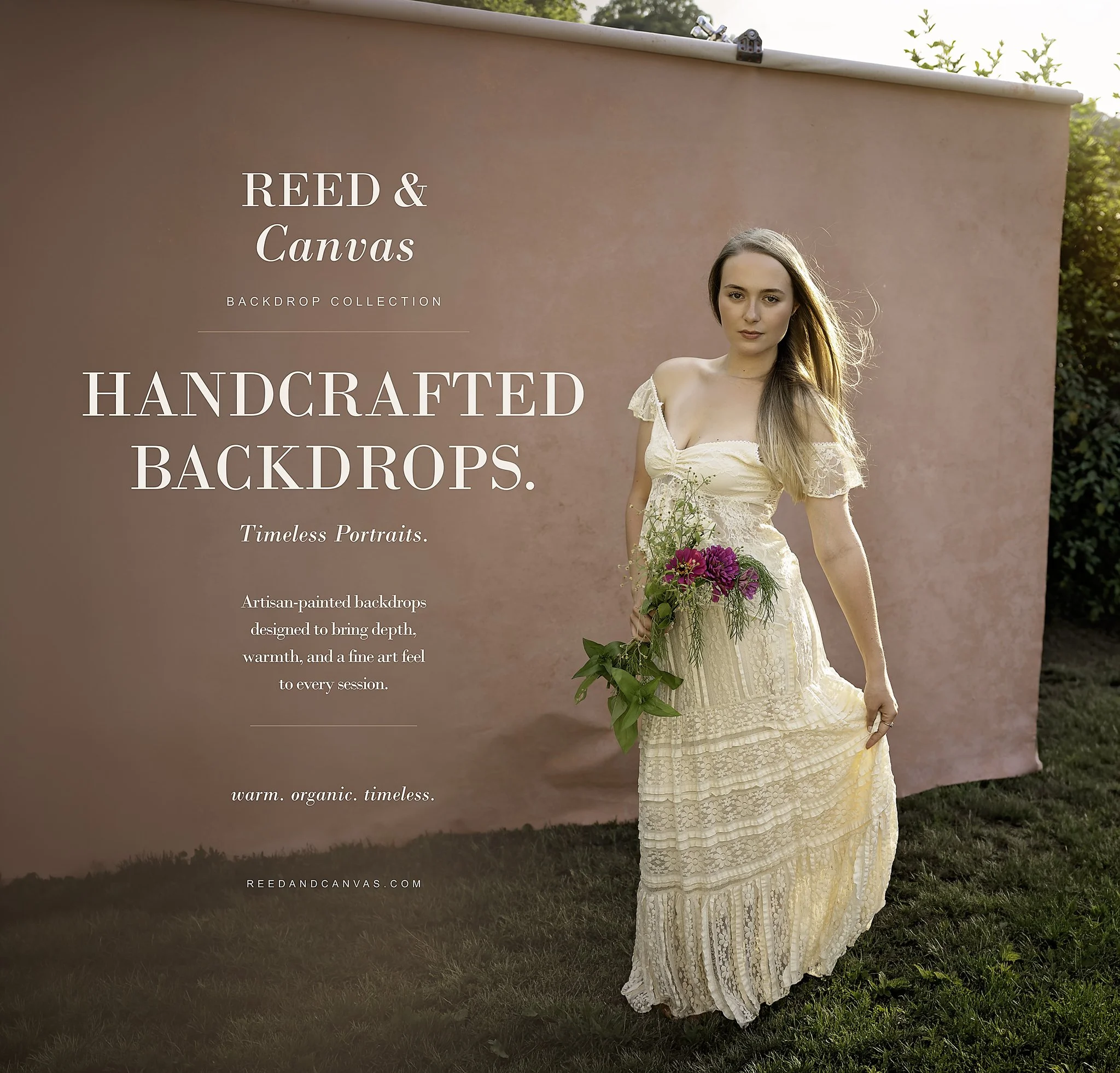 A woman in a cream lace dress holding a bouquet of pink and purple flowers standing outdoors next to a pink backdrop with text about handcrafted backdrops.