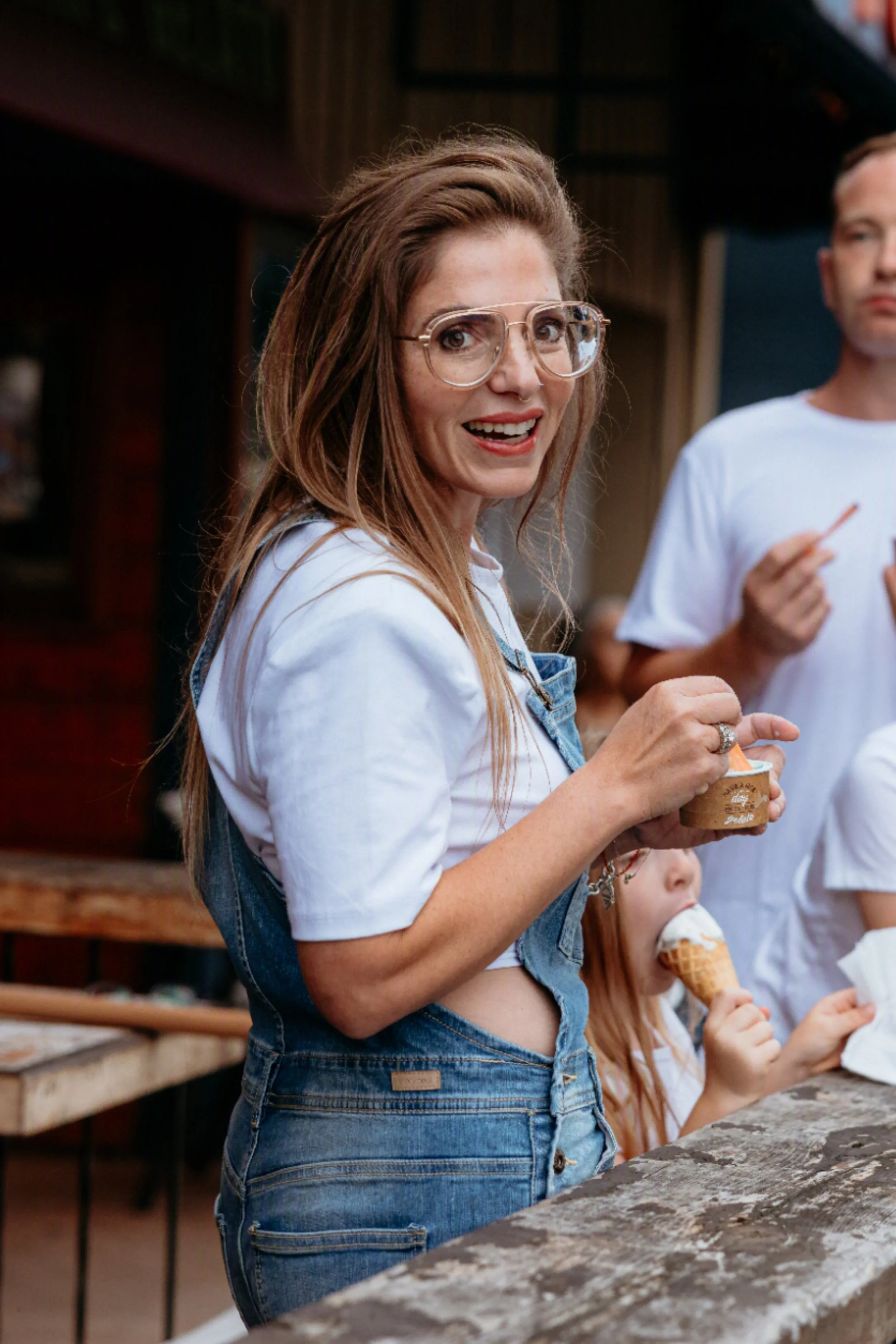 Sara smiles while holding an ice cream cone at Mike's Place.