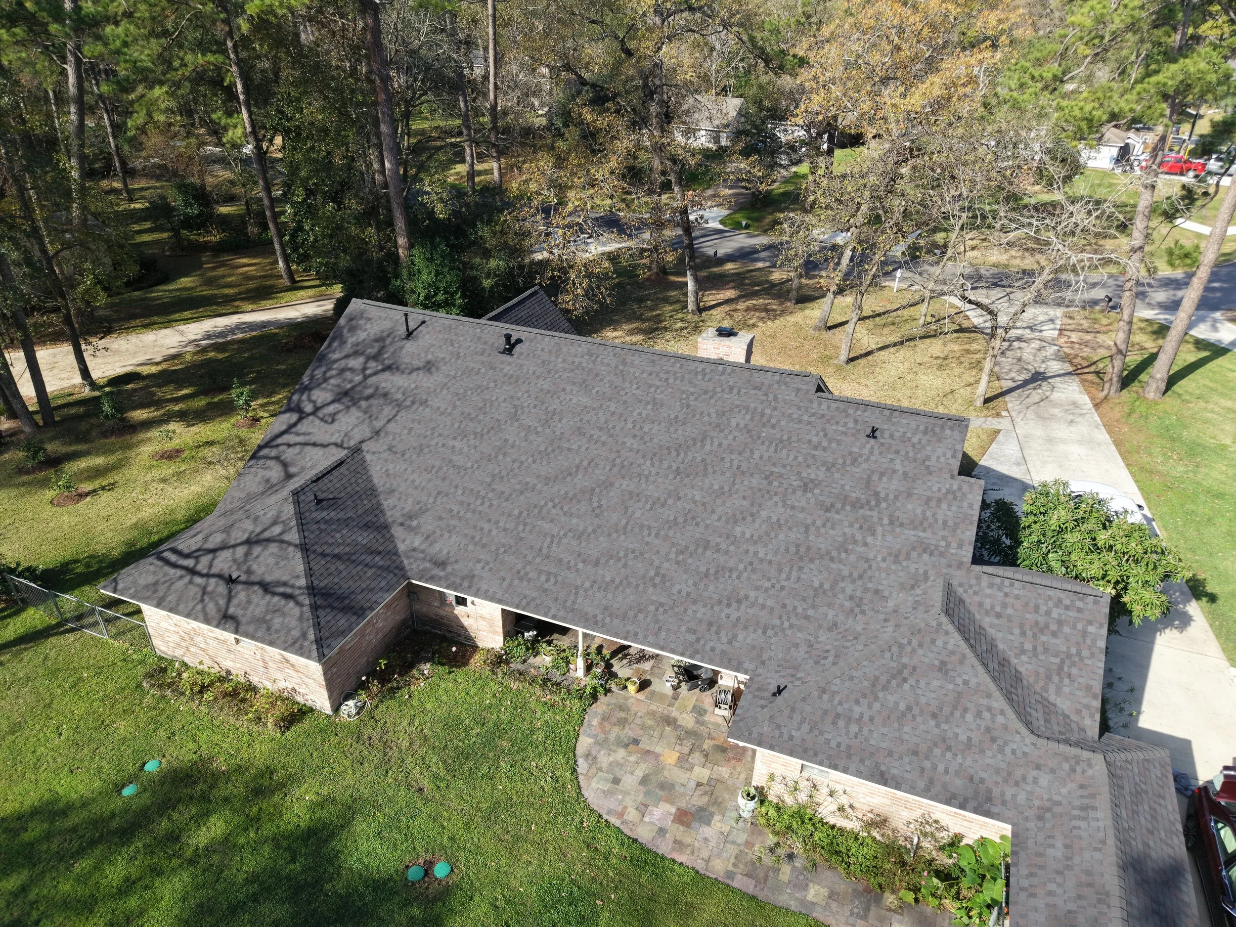 TurnKey Roofing & Restoration — An aerial view of a newly shingled roof in Houston, Texas, using Owens Corning Shingles.