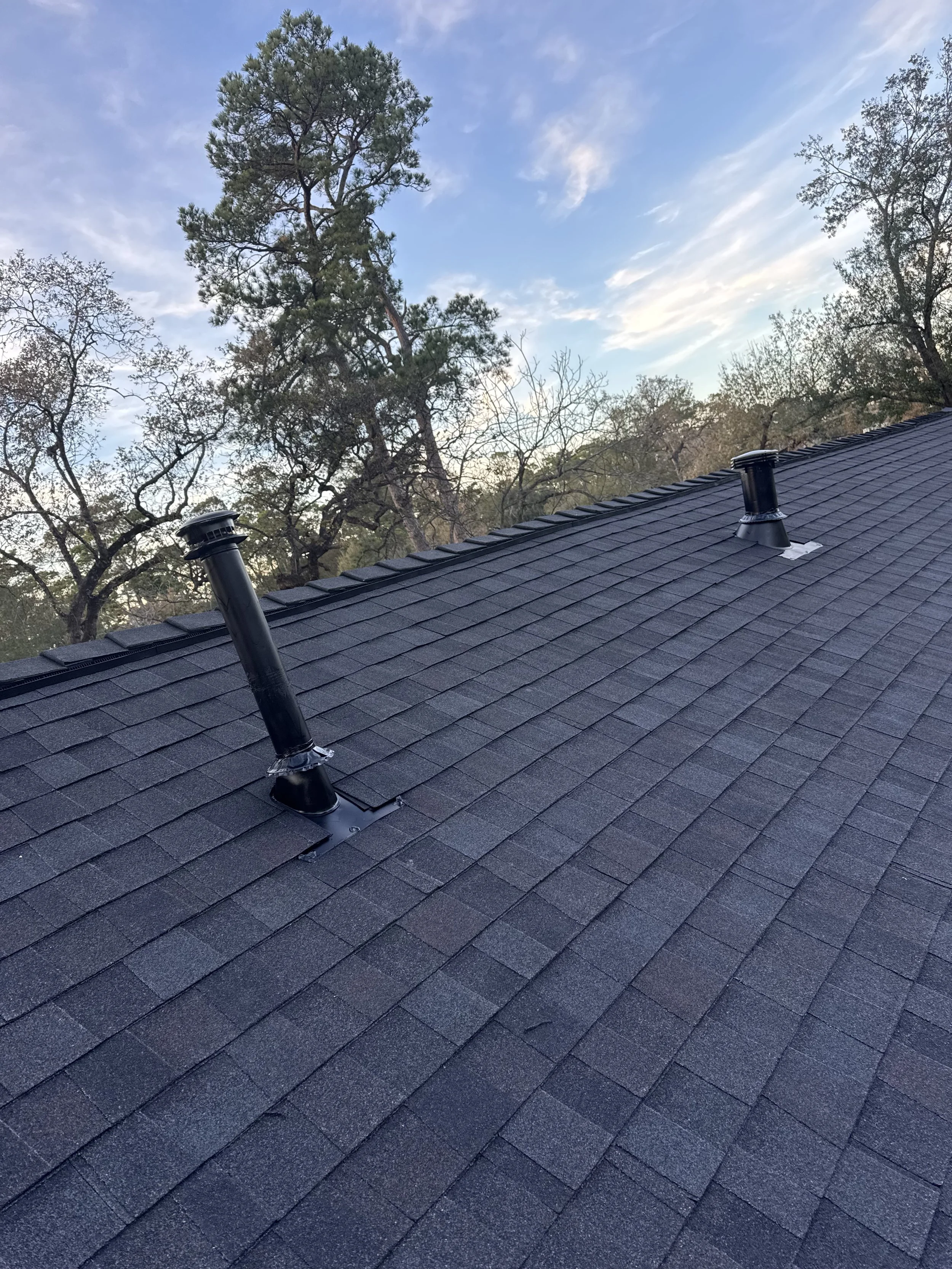 TurnKey Roofing & Restoration — A close-up view of a newly shingled roof in Houston, Texas, using Owens Corning Shingles. 