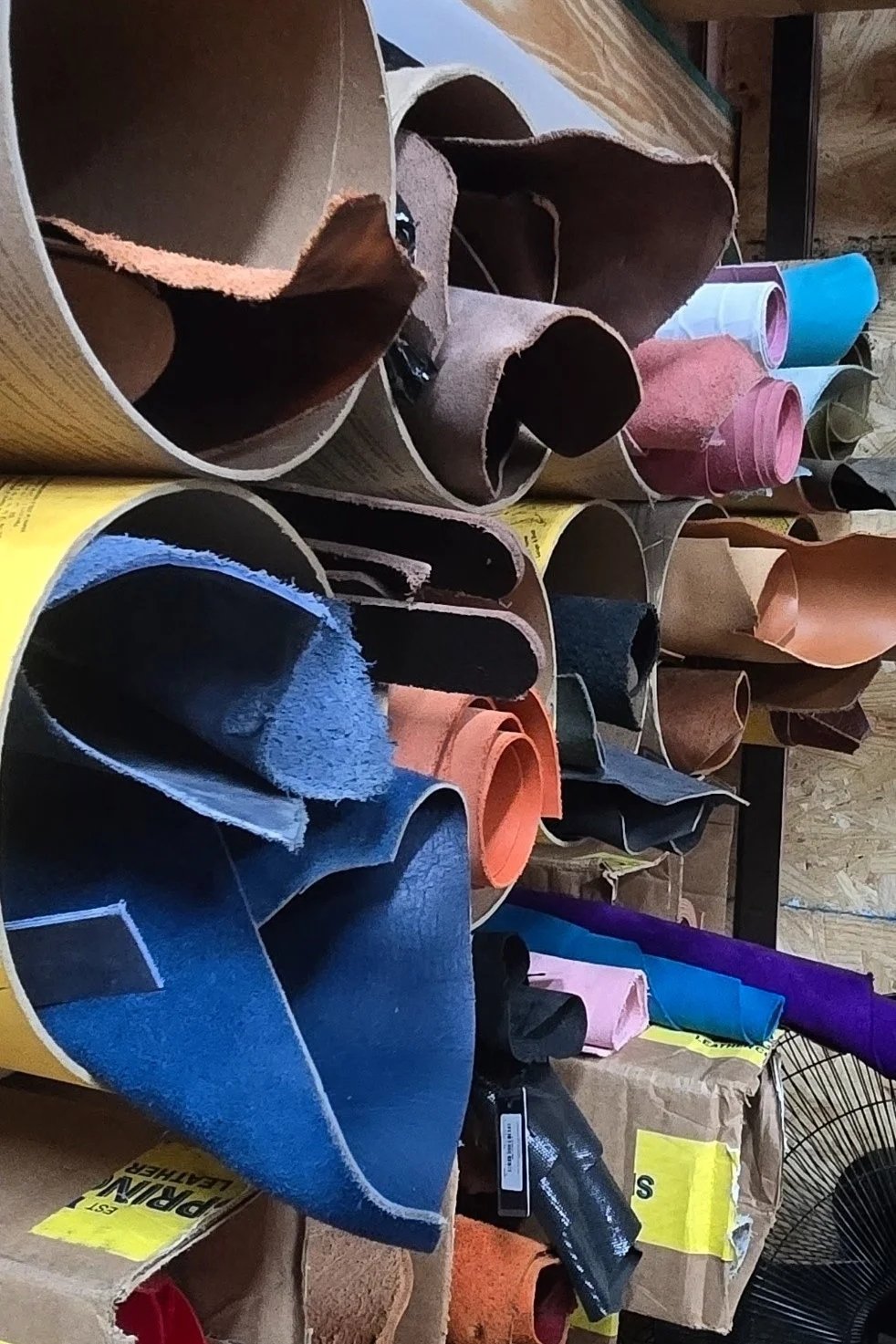 Rolls of leather on display.