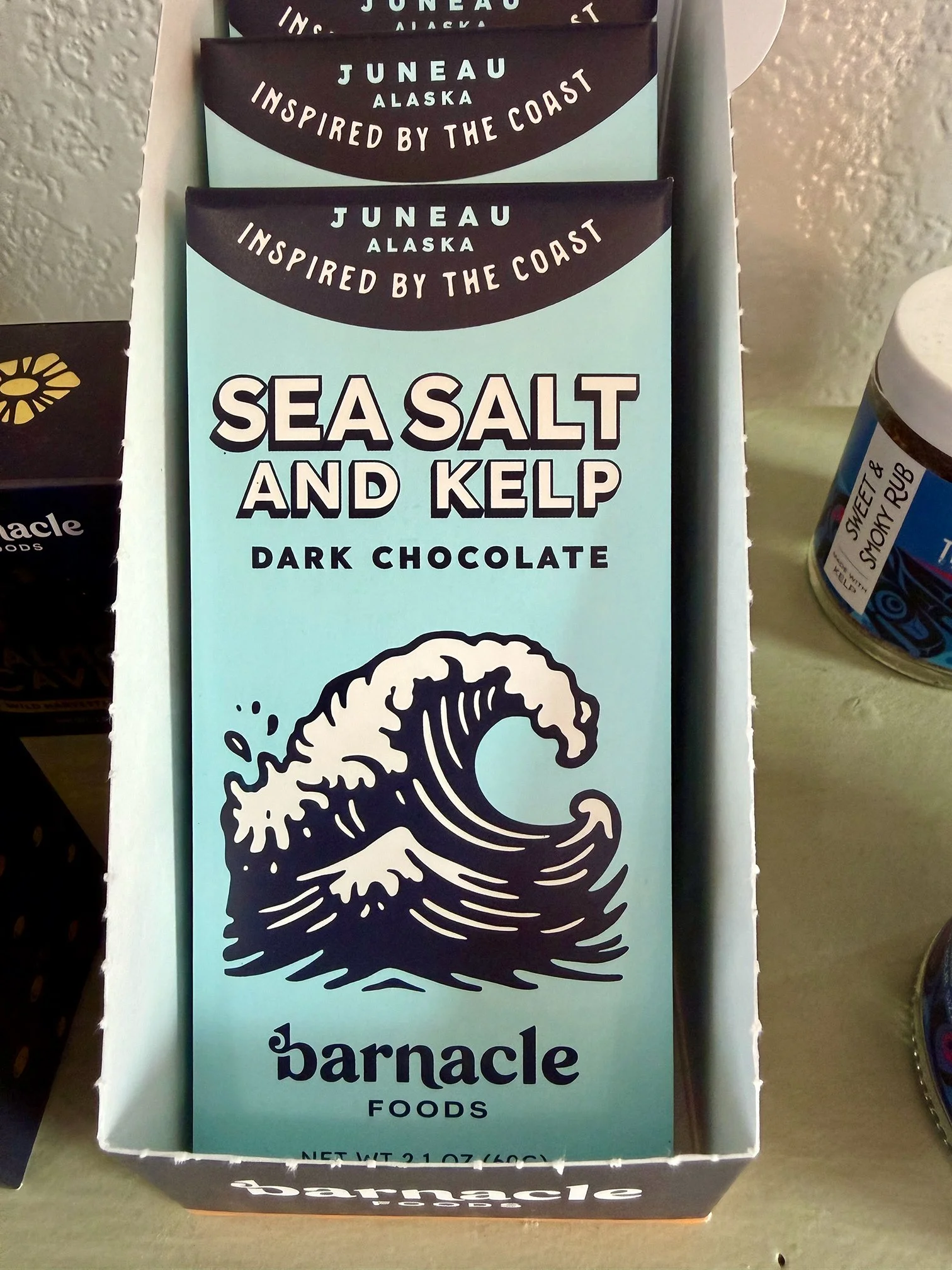 Box of Barnacle Foods Sea Salt and Kelp dark chocolate with a wave graphic on the packaging.