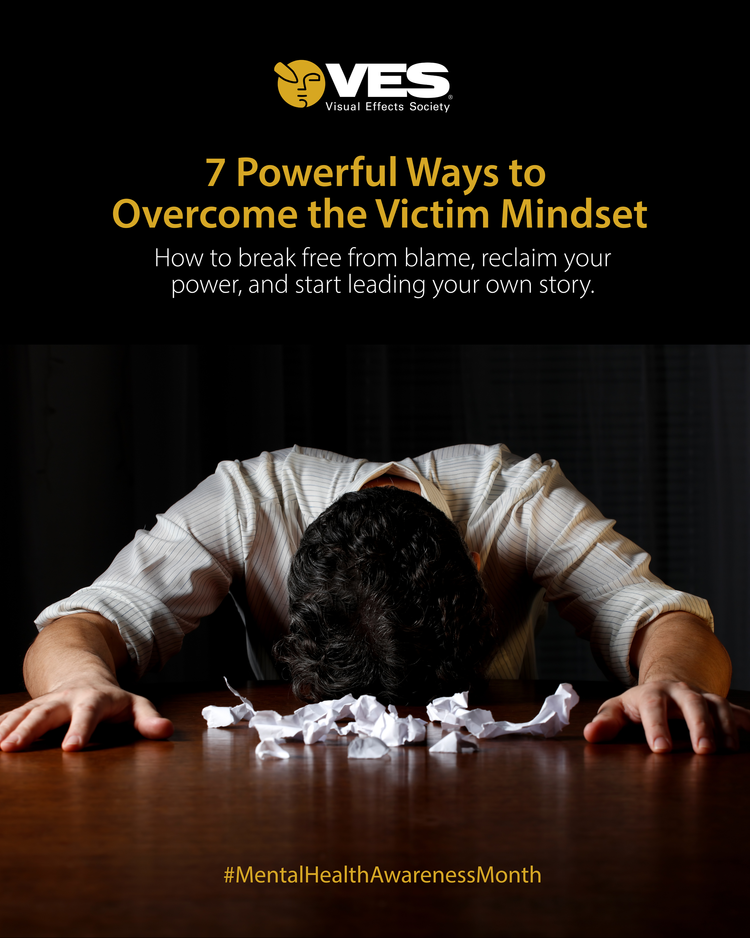 A person with dark curly hair, wearing a light-colored striped shirt, leaning forward with their head down on a table, surrounded by crumpled paper, with the top part of the image showing a black background with text about overcoming the victim mindset and mental health awareness.
