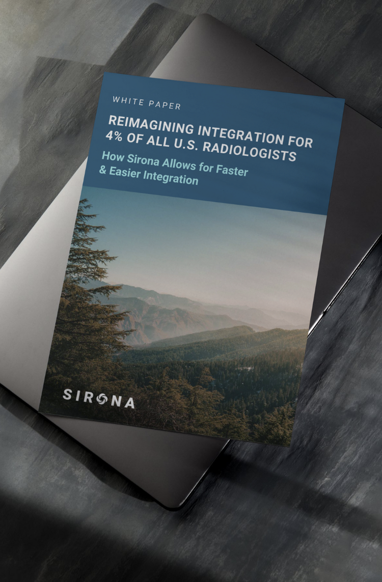 White paper titled "Reimagining Integration for 4% of All U.S. Radiologists" on a gray surface. The cover features a landscape of mountains and trees with a blue sky.