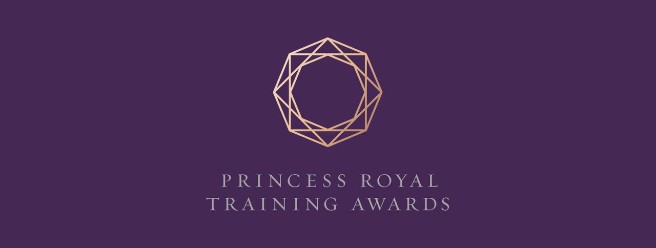 Purple background with a gold geometric crown logo and text that reads "Princess Royal Training Awards."