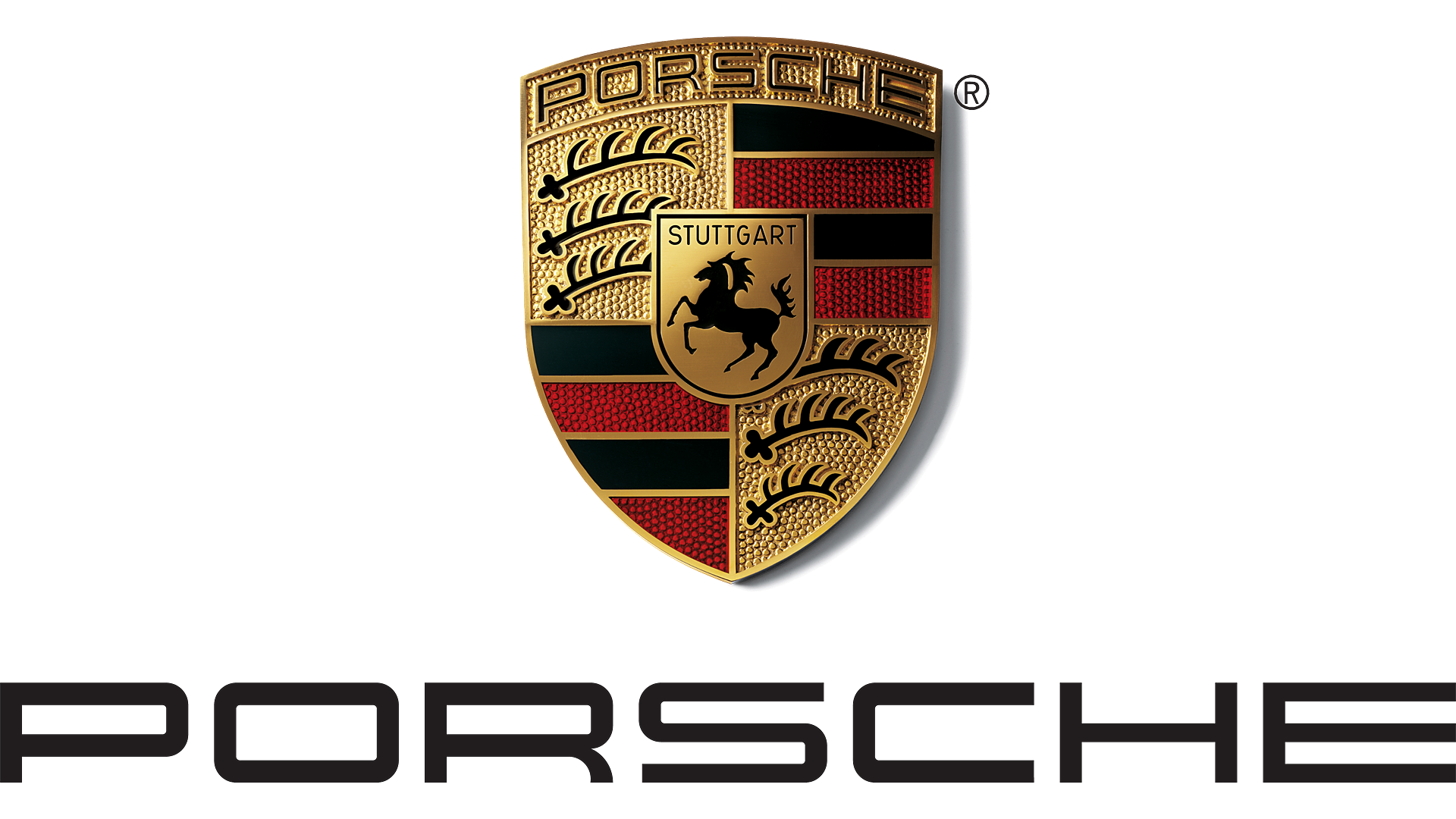 Close-up of Porsche crest emblem with gold accents, black horse, and red and black stripes on a dark background.