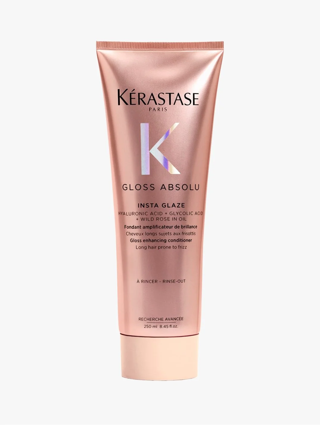 Pink tube of Kérastase Gloss Absolu Insta Glaze hair glossing conditioner with text detailing ingredients and usage instructions.