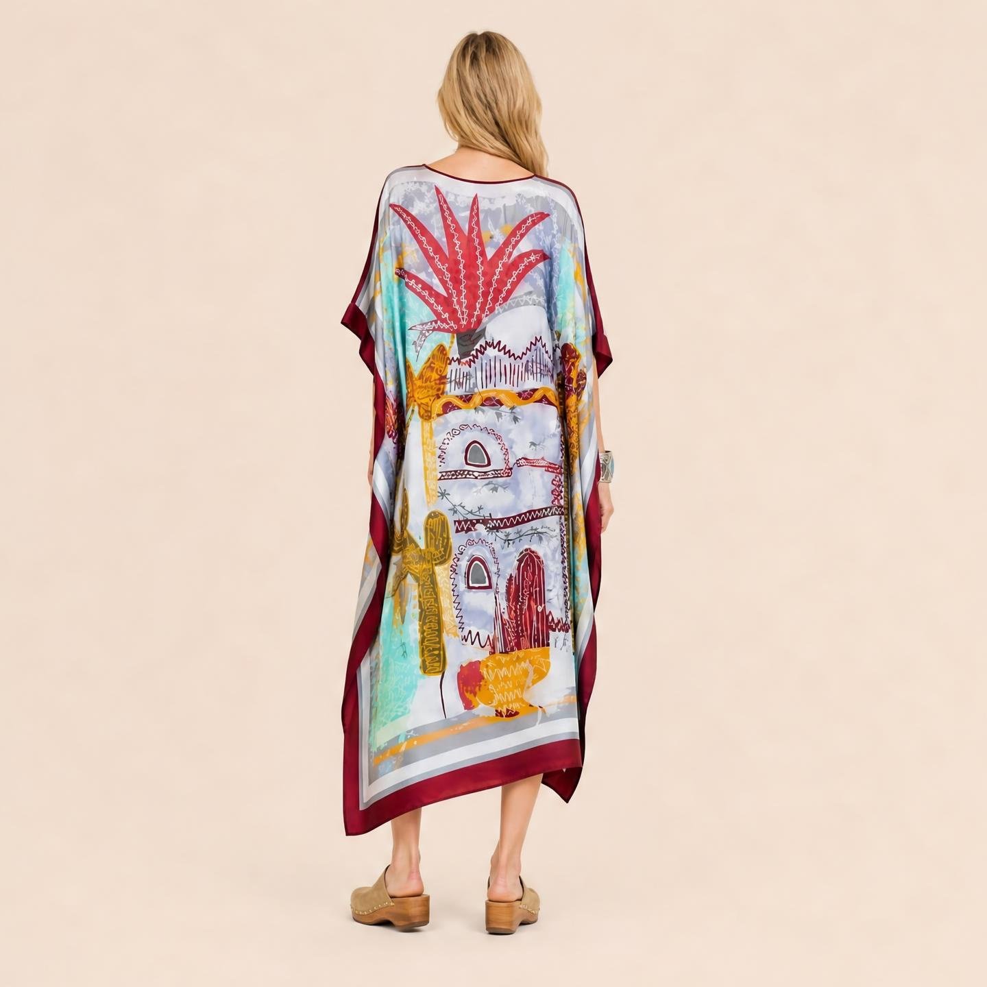 Santa Fe resort wear long silk kaftan in scarlet agave and adobe arches on pale desert blue