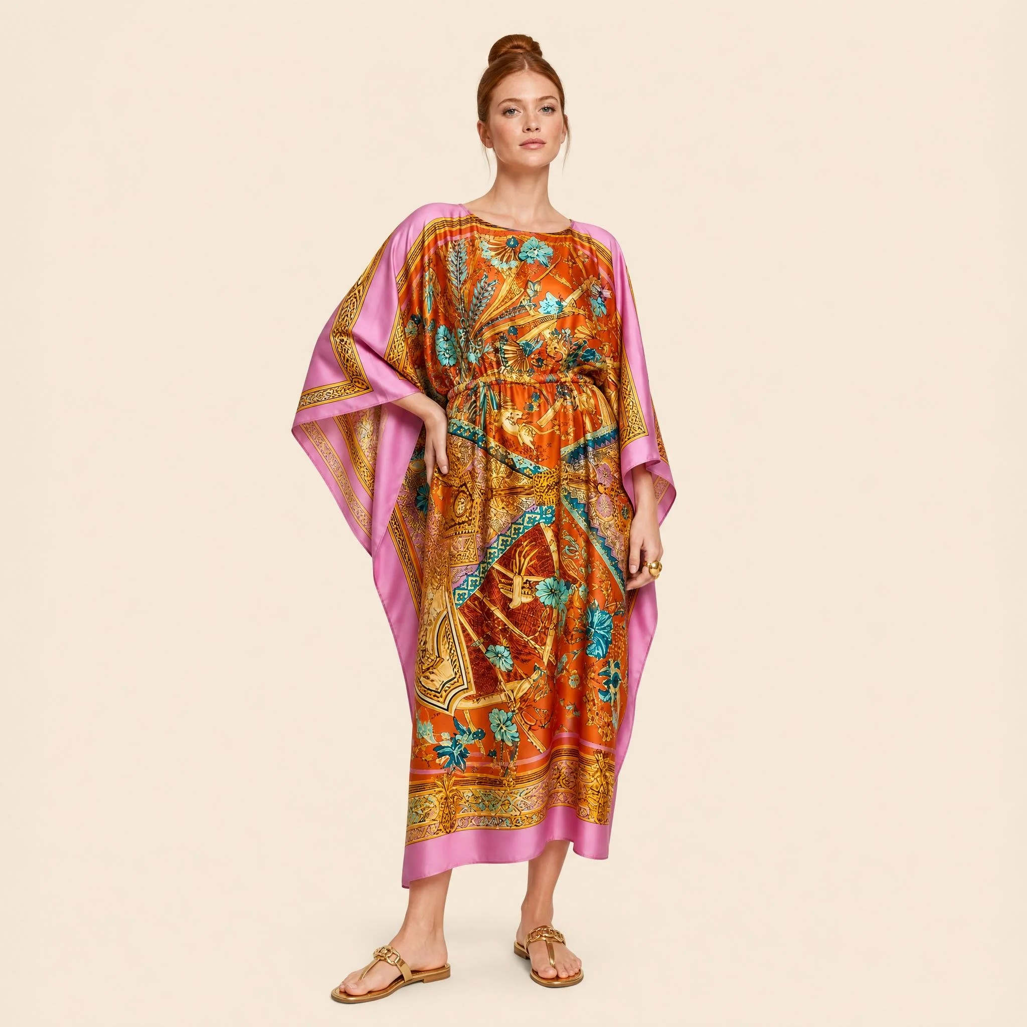 Saffron Palace long silk kaftan in burnt orange and gold palace ornament with a pink border