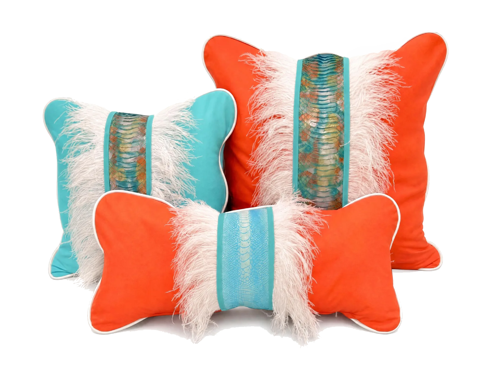 Colorful decorative pillows with feathered and snakeskin patterns in orange and turquoise colors.