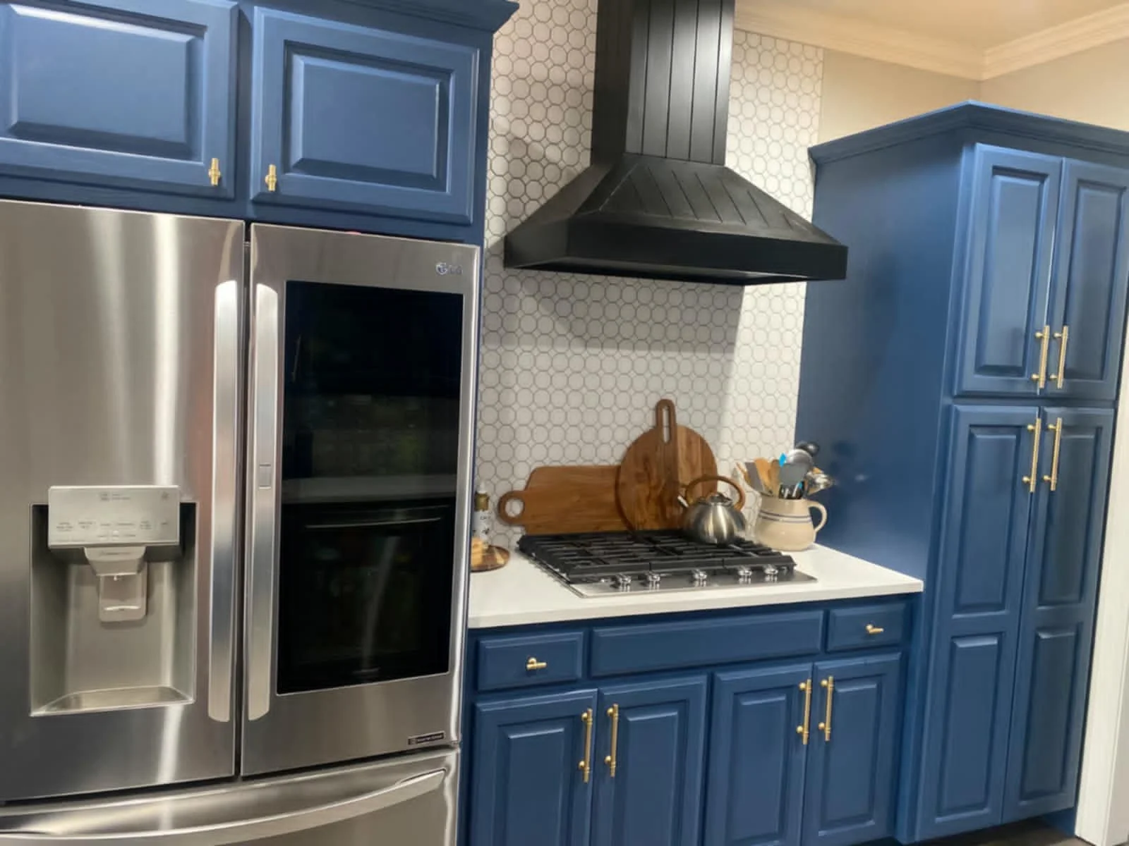 Stripped and painted the cabinets, added new hardware, & added a new backsplash throughout