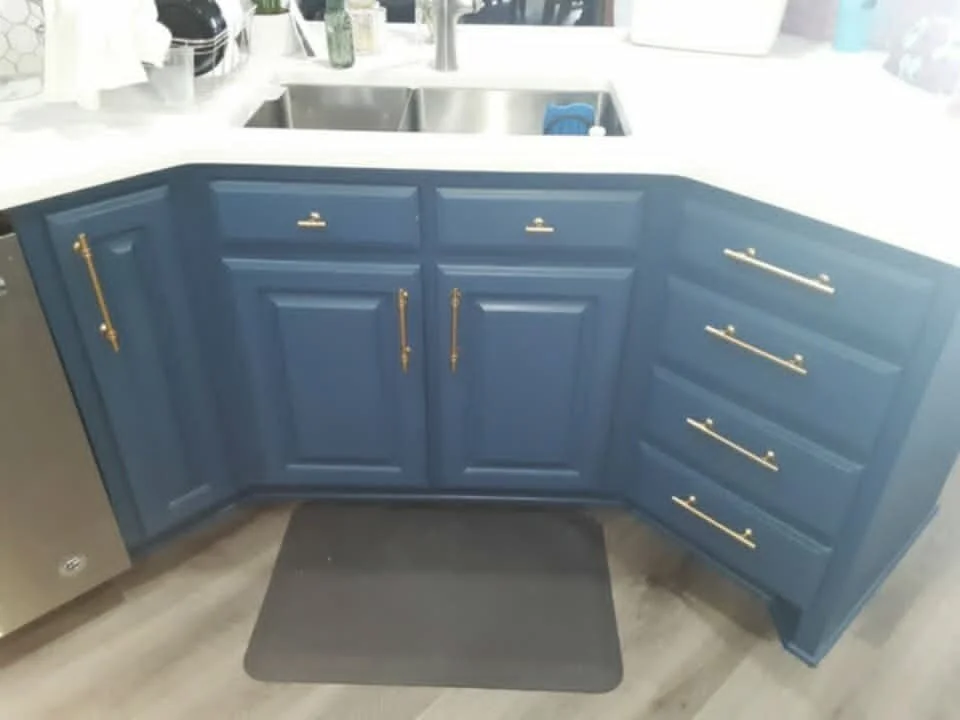 Stripped and painted the cabinets, added new hardware, & added a new backsplash throughout