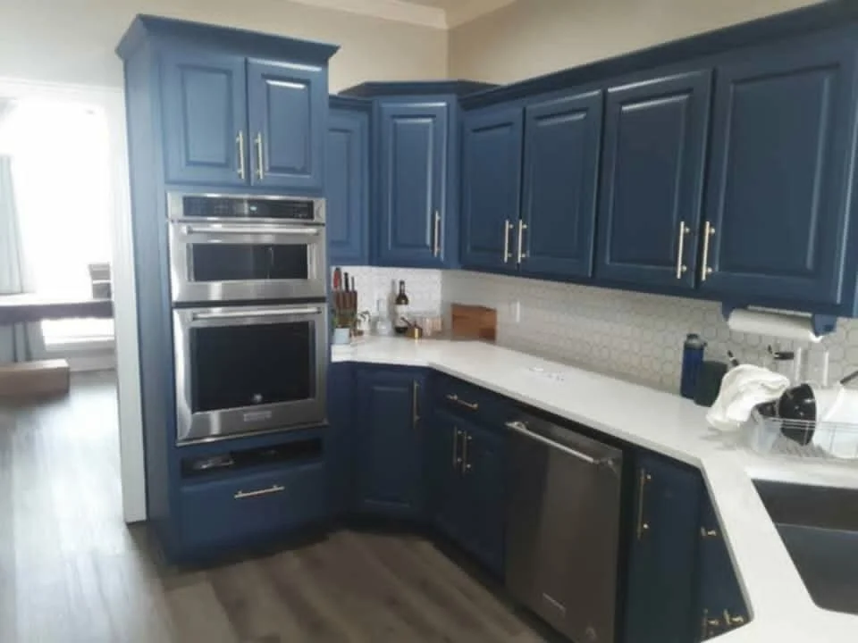 Stripped and painted the cabinets, added new hardware, & added a new backsplash throughout