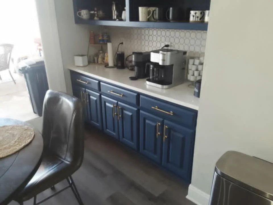 Stripped and painted the cabinets, added new hardware, & added a new backsplash throughout