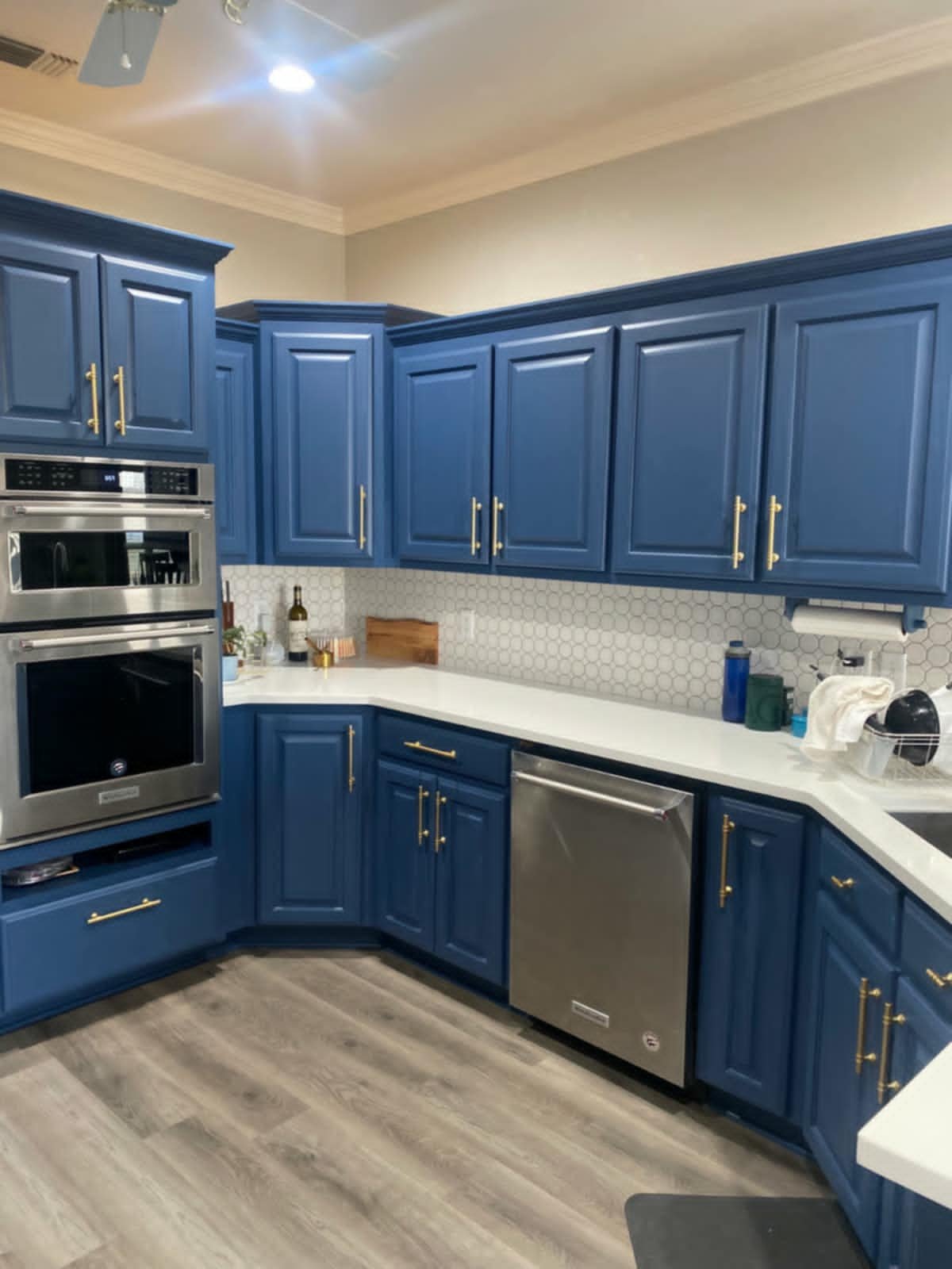Stripped and painted the cabinets, added new hardware, & added a new backsplash throughout