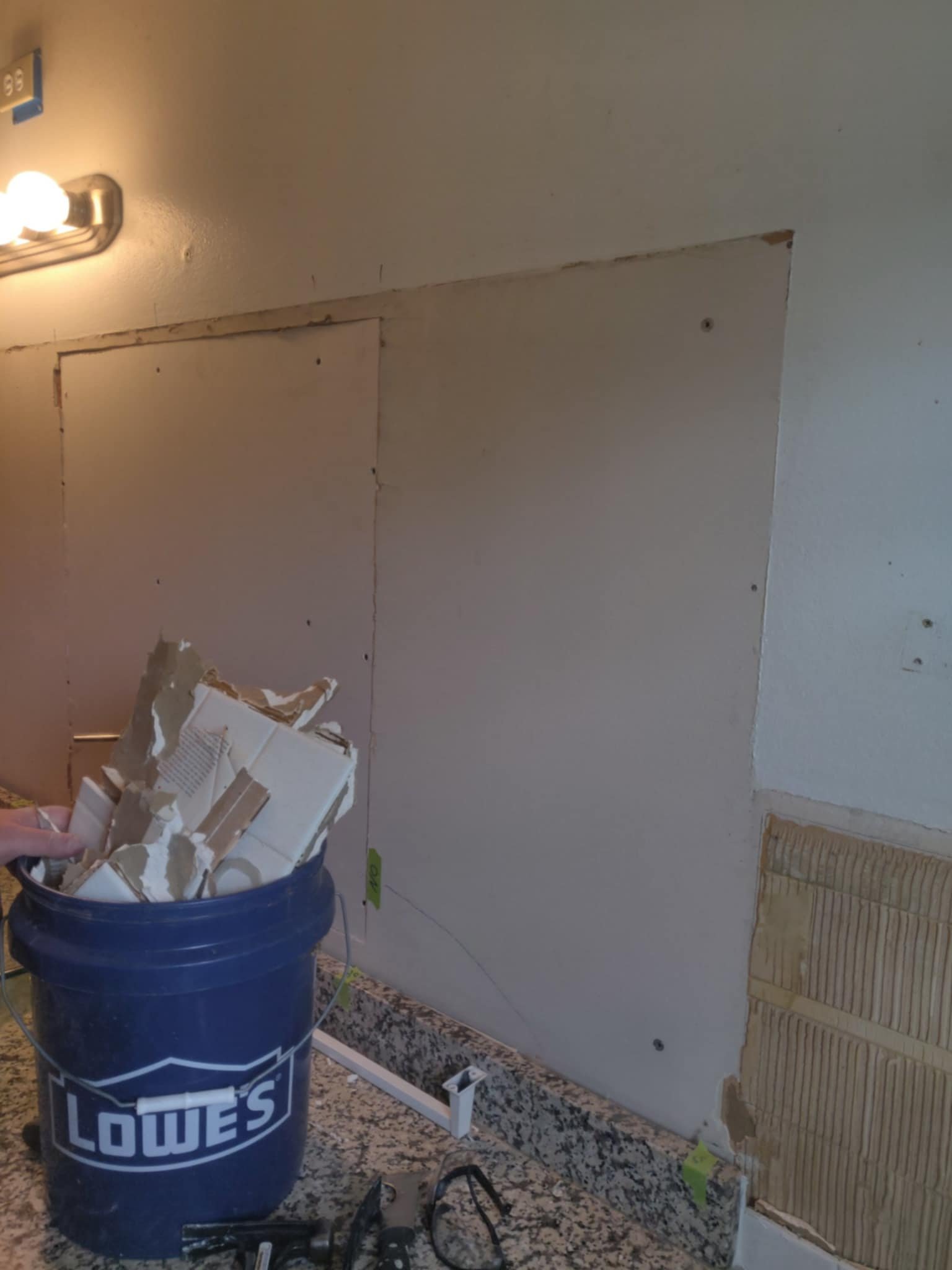 Removing the large mirror and patching the wall