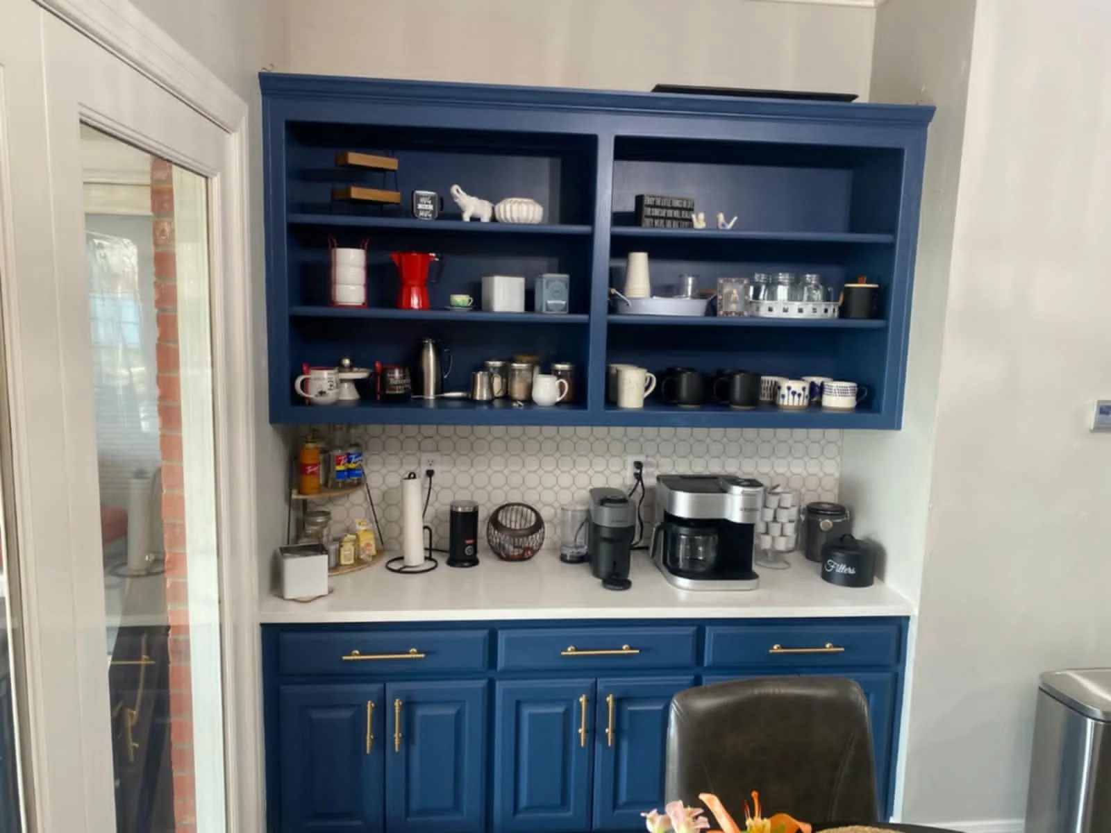 Stripped and painted the cabinets, added new hardware, & added a new backsplash throughout