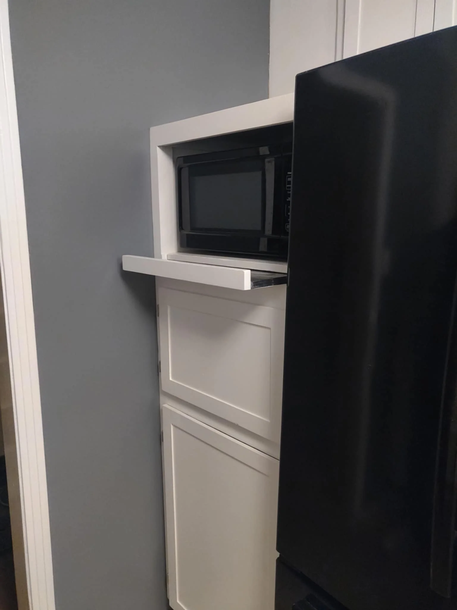 Custom microwave cabinet with sliding tray