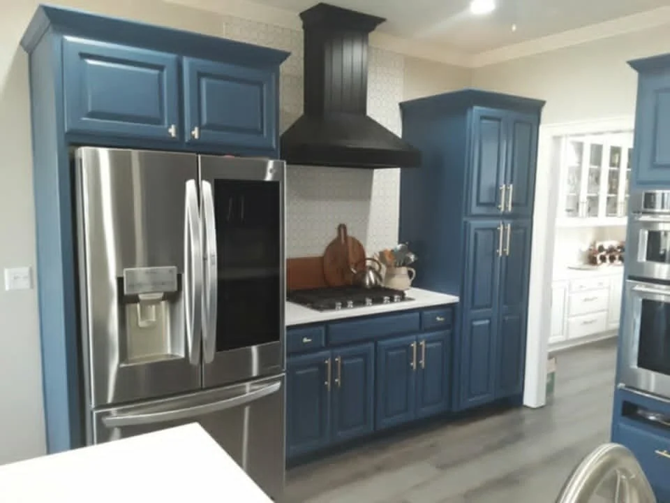 Stripped and painted the cabinets, added new hardware, & added a new backsplash throughout