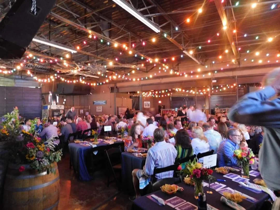 Covenant Children's Storytellers. Guests enjoying dinner by Chimy's in the festively lit Depot Patio Venue to raise money for Covenant Children's Hospital.