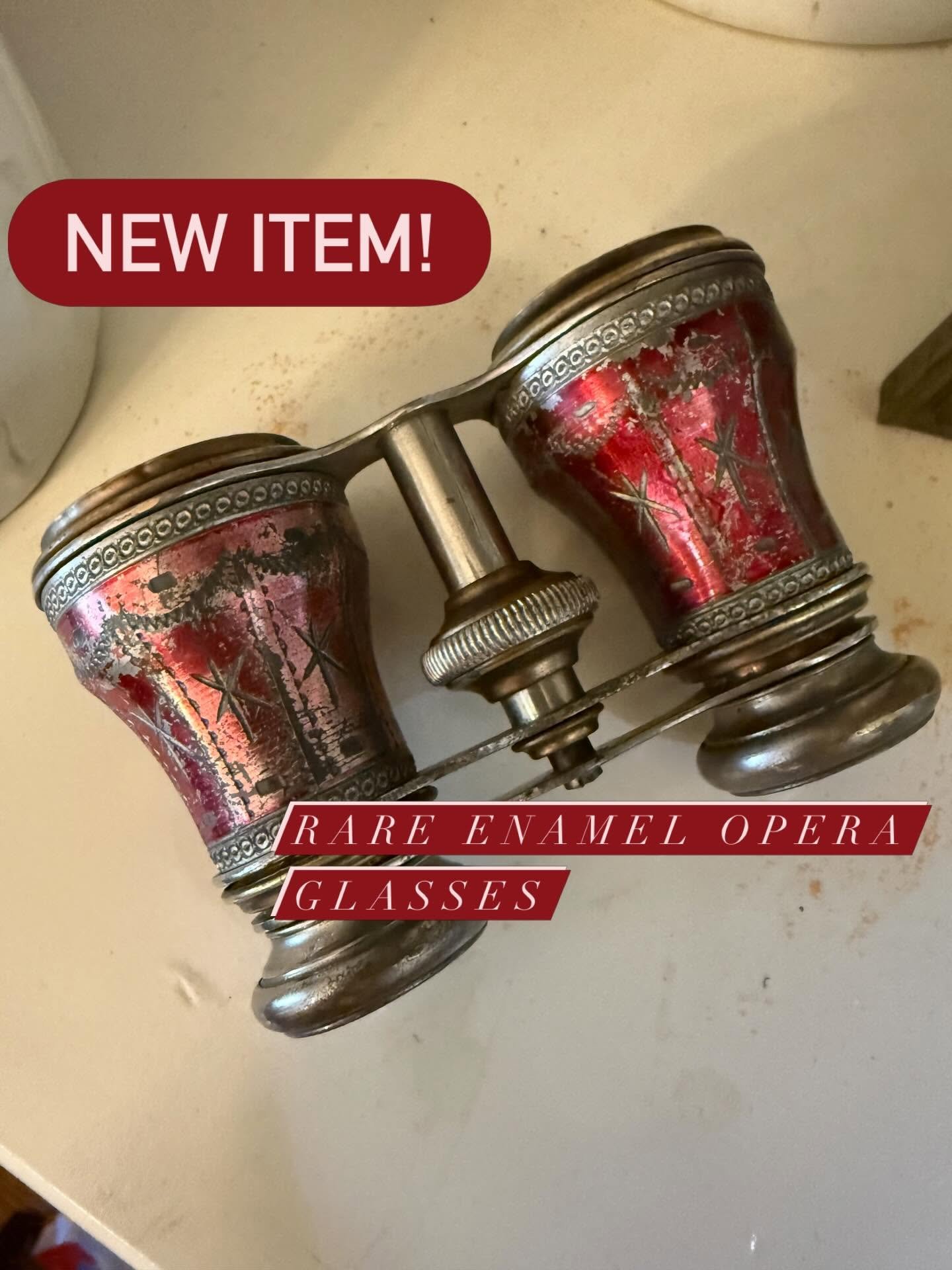 Close-up of vintage opera glasses with red and silver decorative enamel, labeled as rare enamel opera glasses with a red banner highlighting 'NEW ITEM!'.