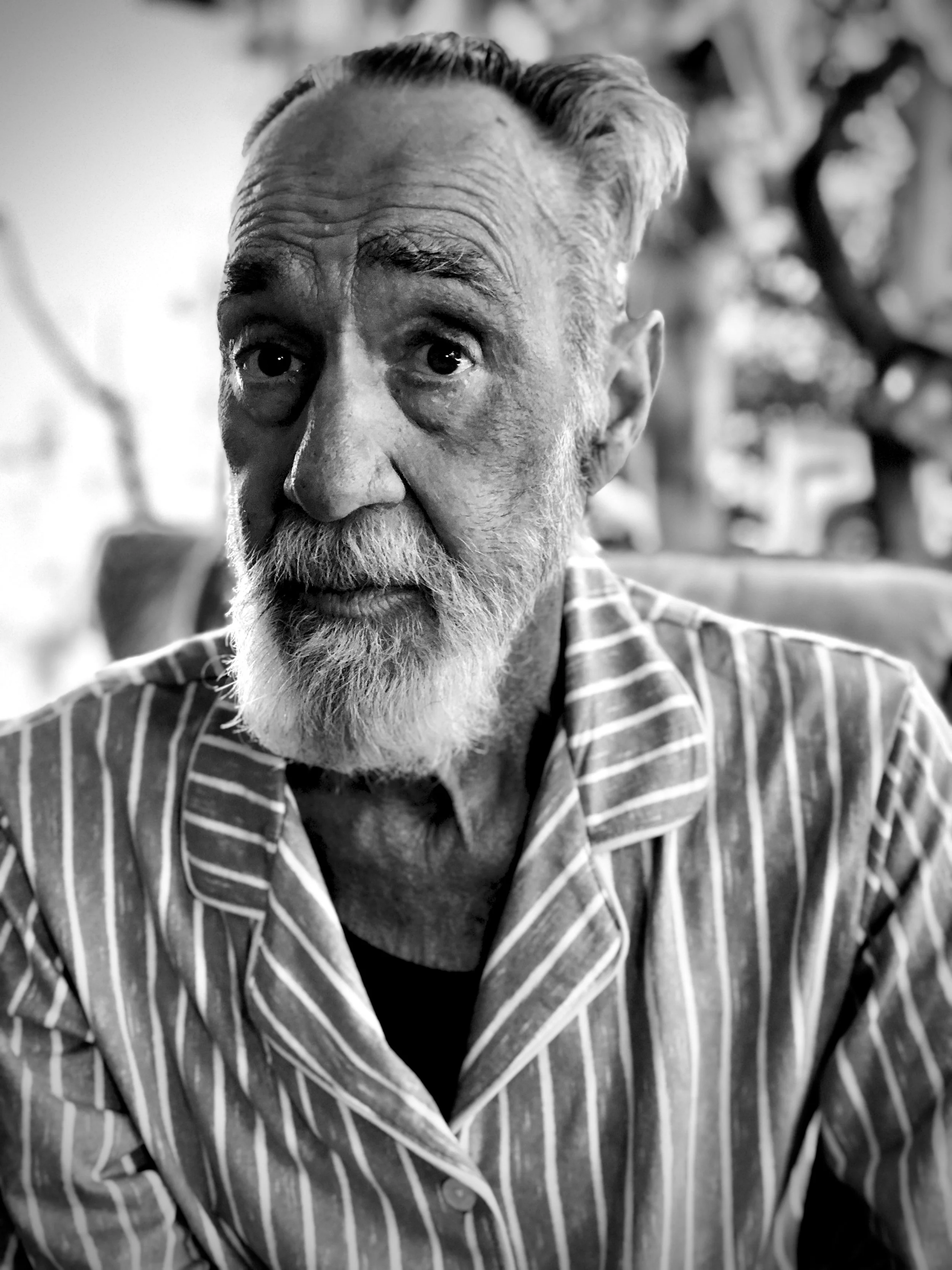 A black and white close-up portrait of Charles Eddy Lepp