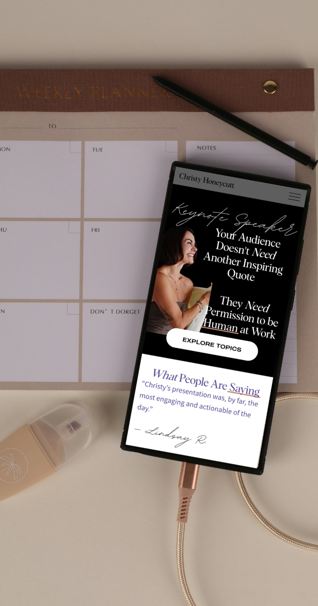 A smartphone displaying a keynote presentation titled "Your Audience Doesn't Need Another Inspiring Quote" by Christy Honeycutt, on a desk with a weekly planner, pen, and a bottle of lotion.