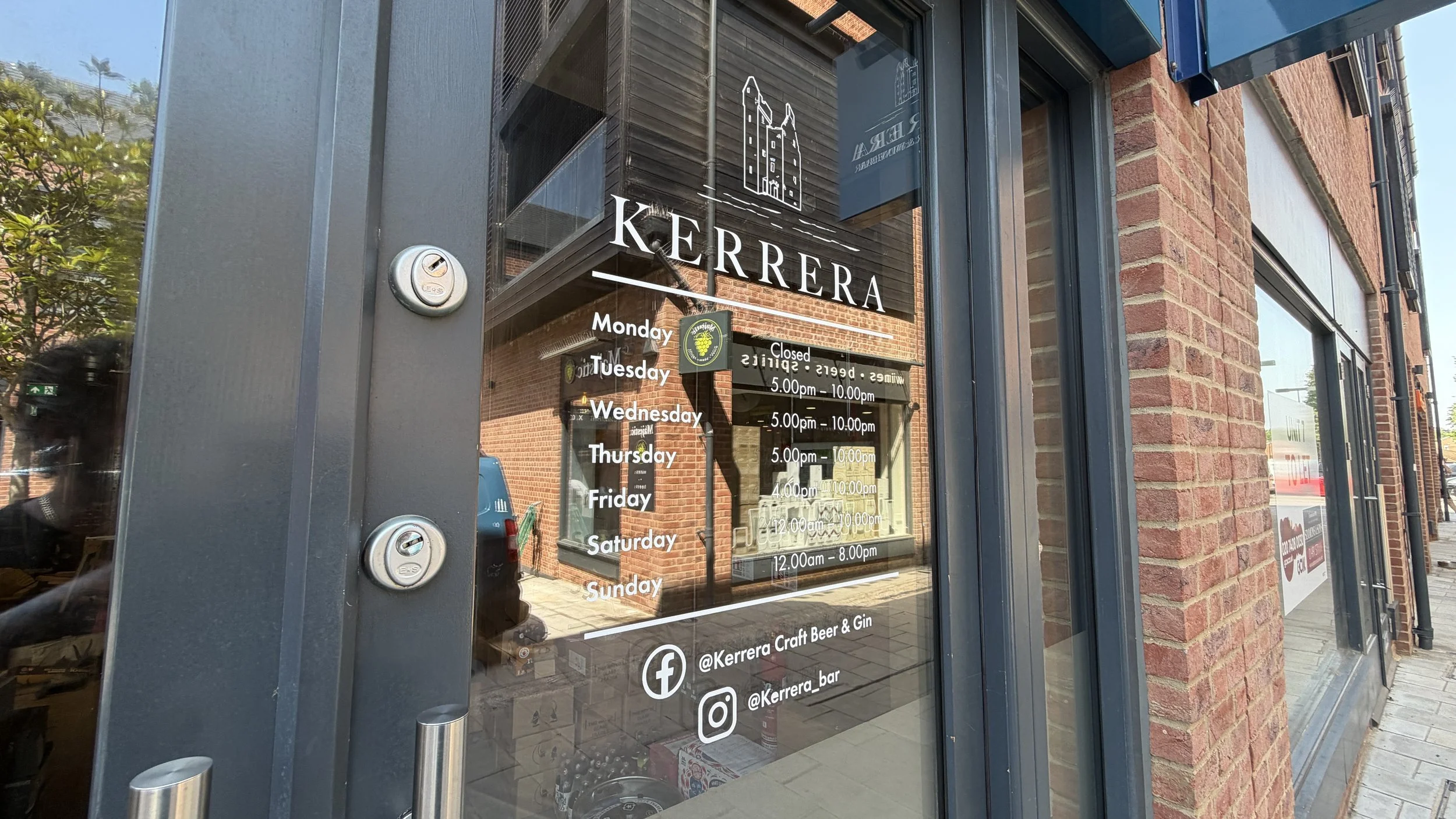 Window graphics: Opening hours and branded window decals for Kerrera Craft Beer and Wine Bar
