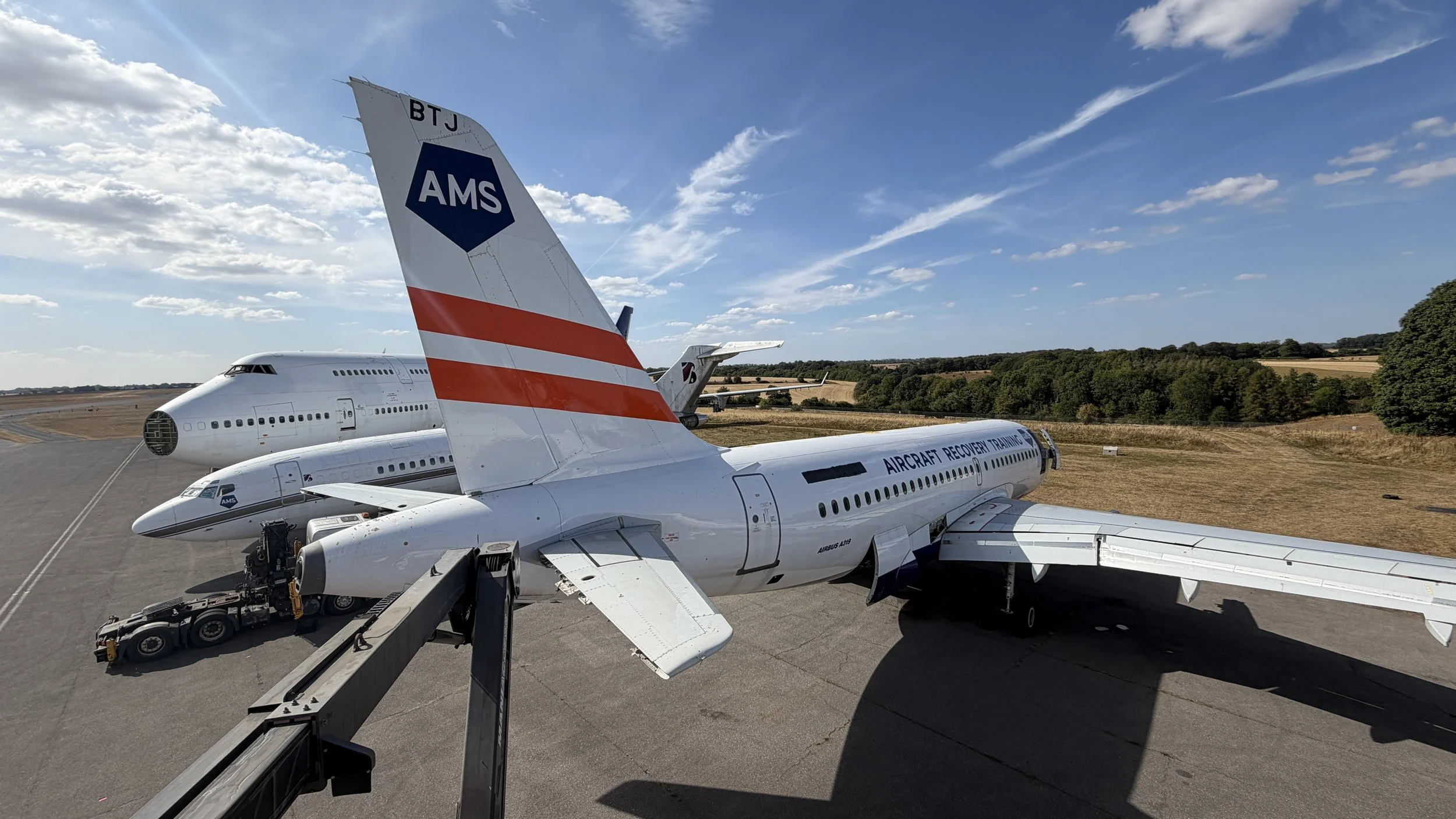 Aircraft vinyl graphics installation using access steps near Cirencester