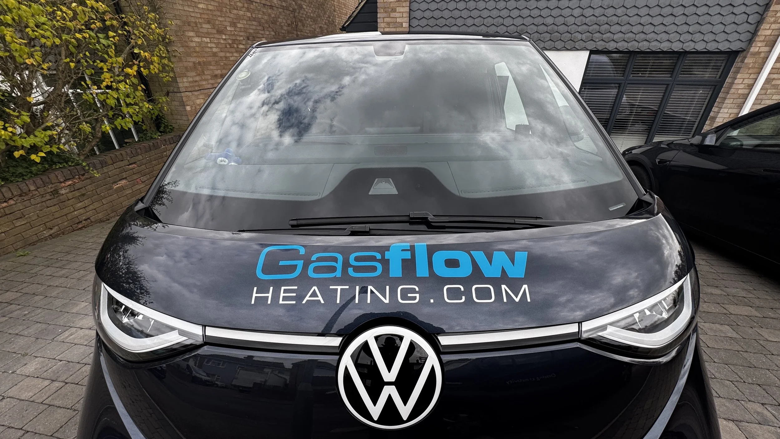 Front view of Gasflow Heating branded electric VW ID. Buzz van.JPG