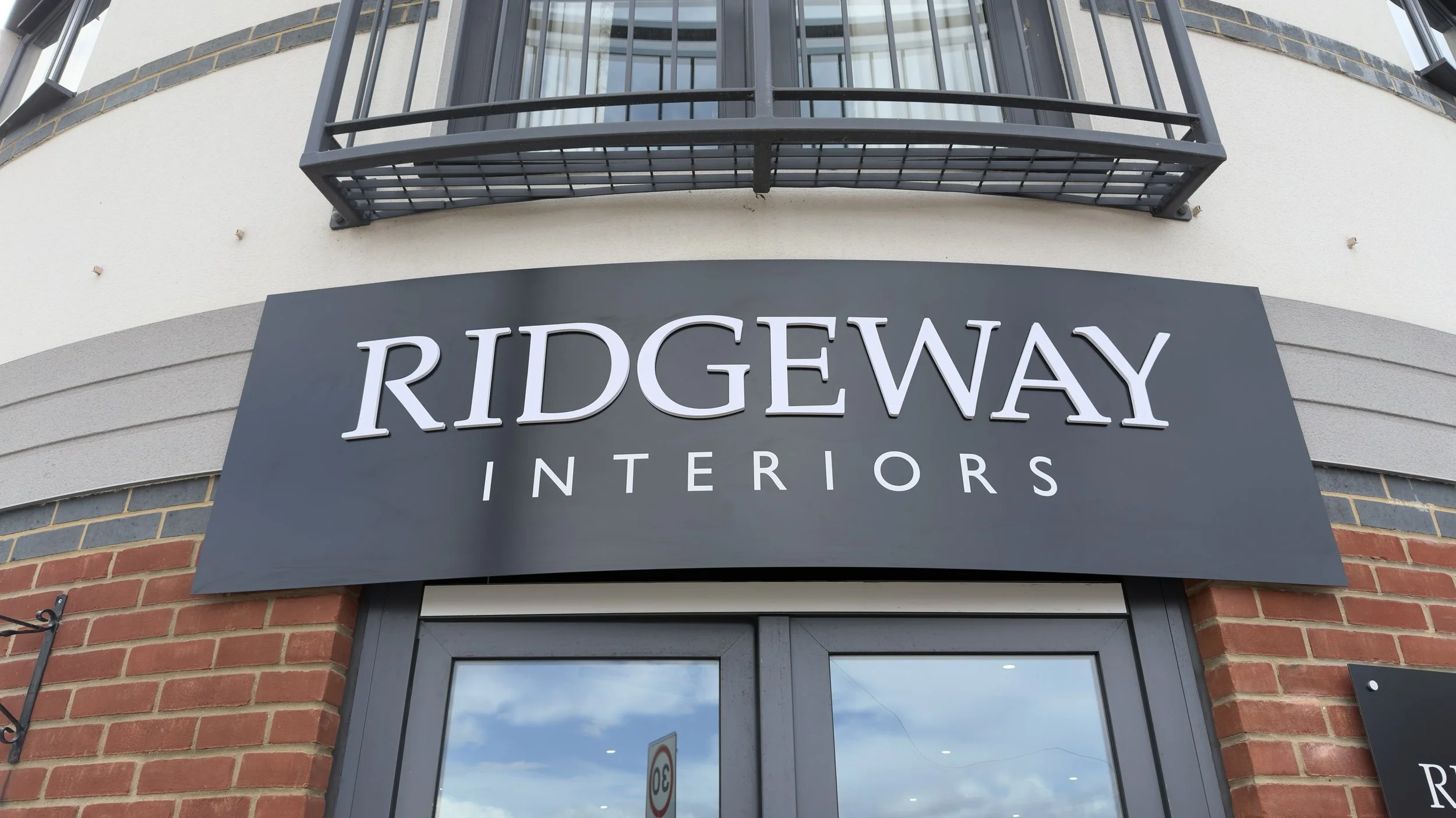 Close-up of bespoke fascia sign with raised 3D lettering for Ridgeway Interiors.jpeg
