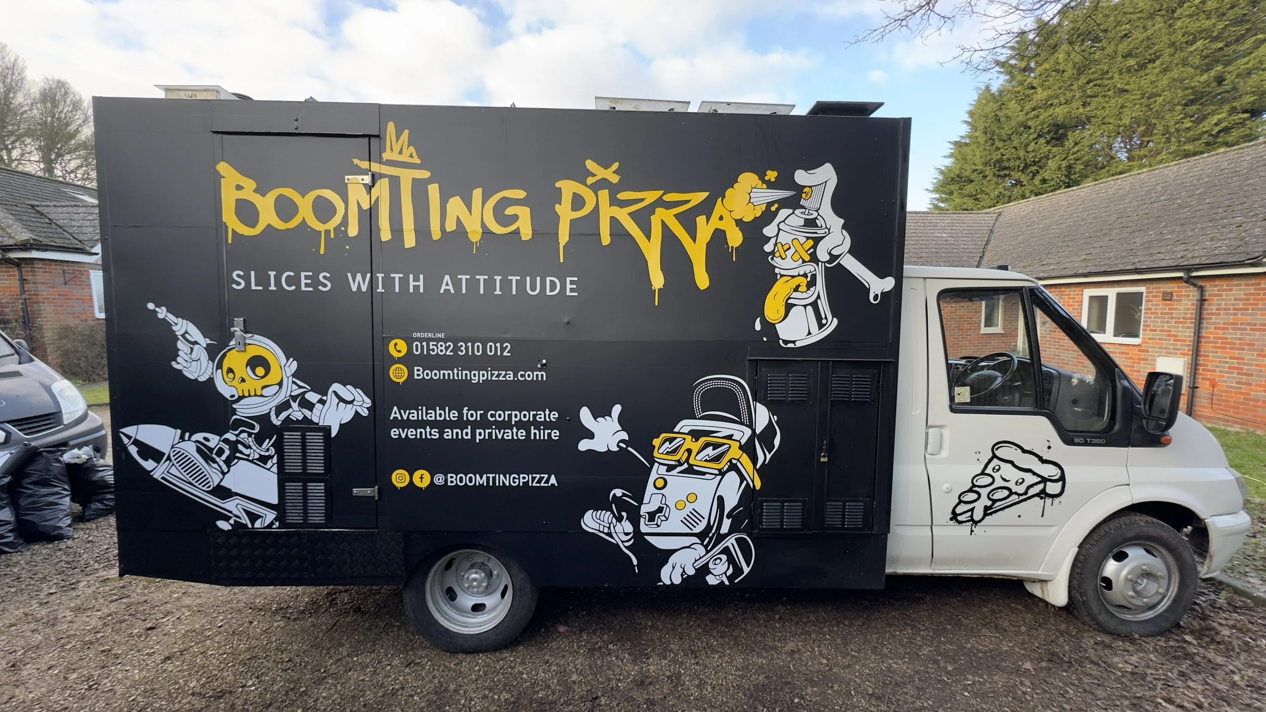 Opposite side of Boomting Pizza catering truck wrap with large logo and event hire information.jpeg