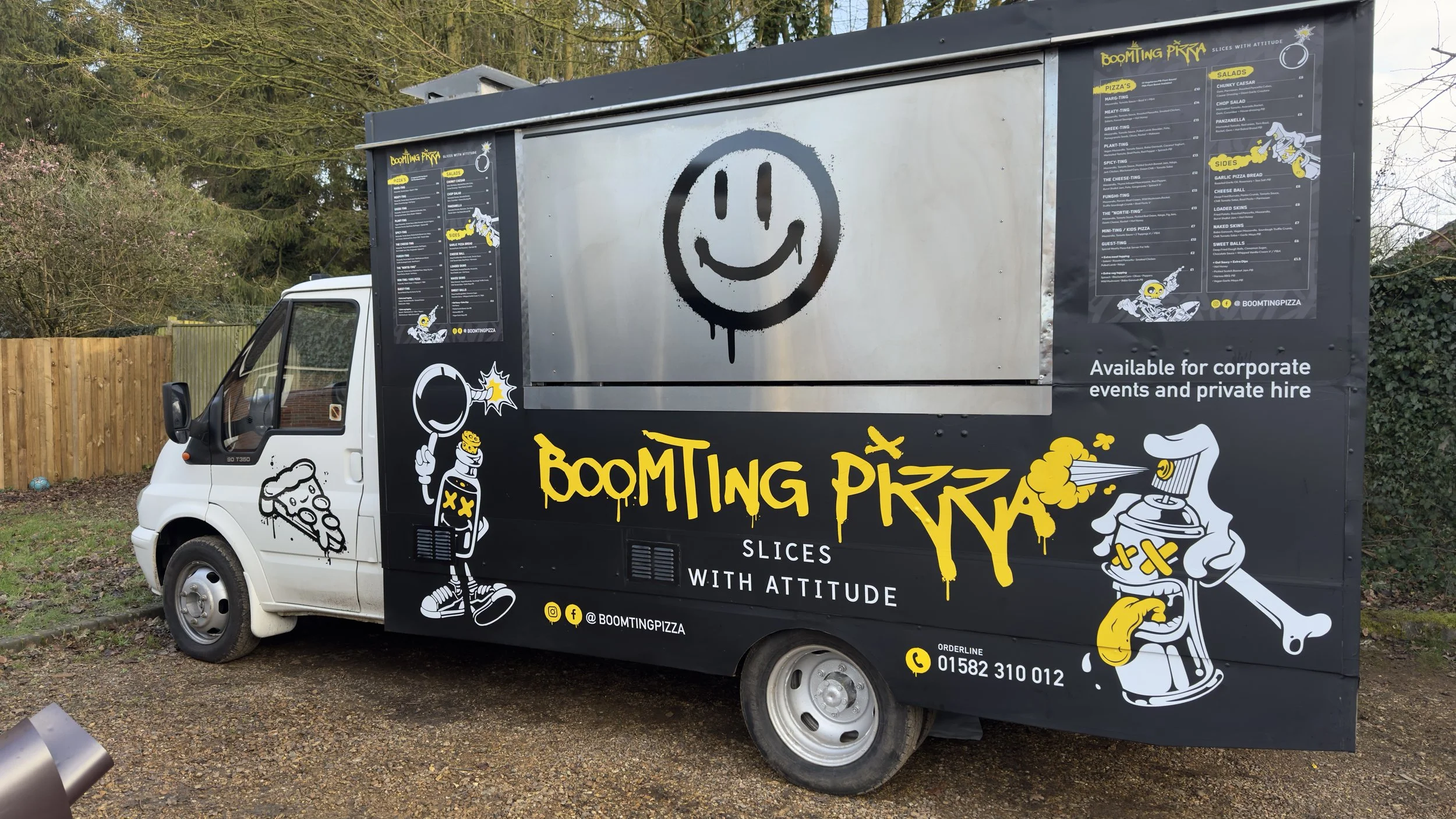 Side view of Boomting Pizza food truck wrap in Harpenden with serving hatch and bold yellow branding.jpeg