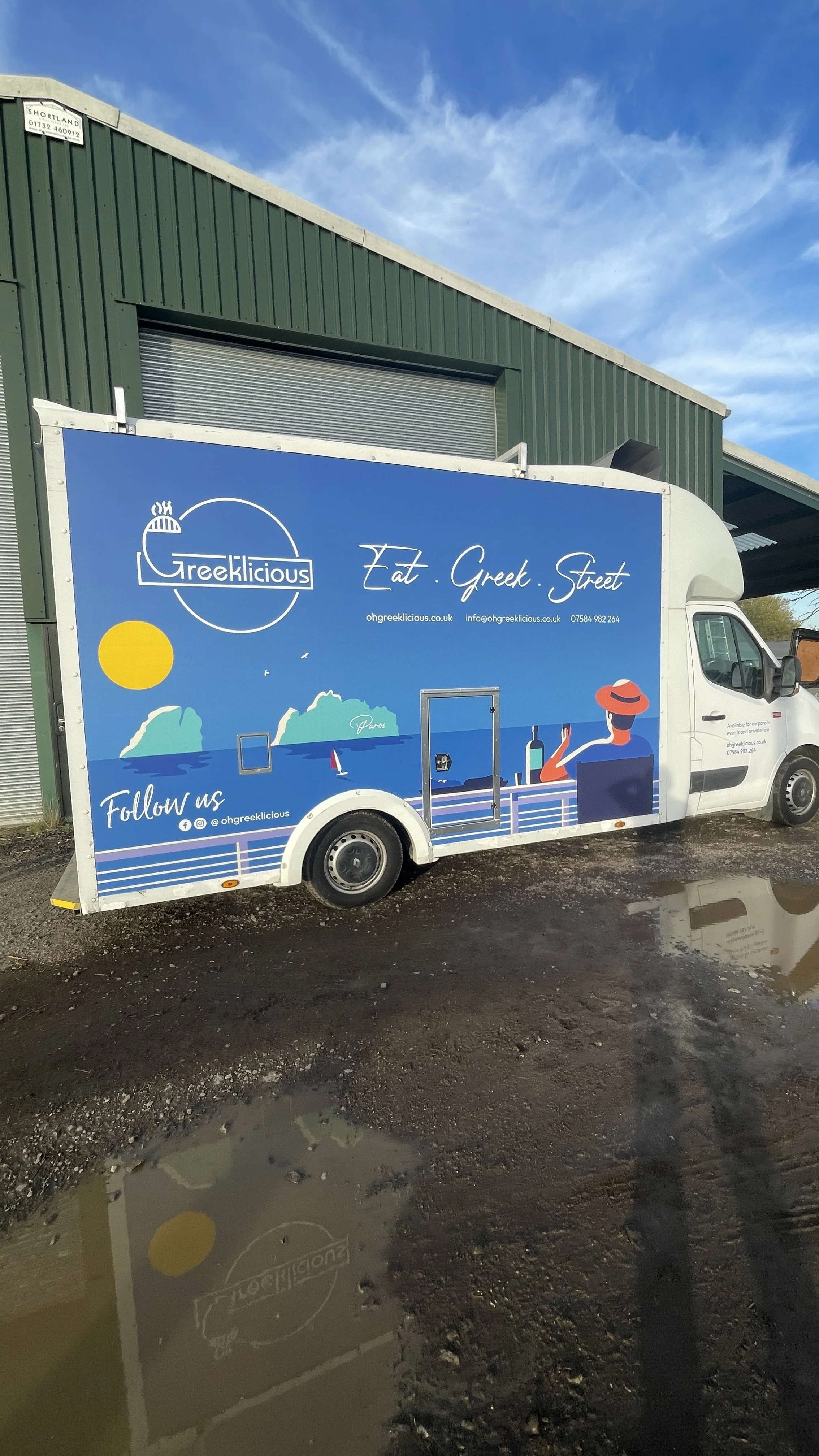 Bespoke Mediterranean food truck branding with illustrated Greek coastline and catering van graphics.JPG