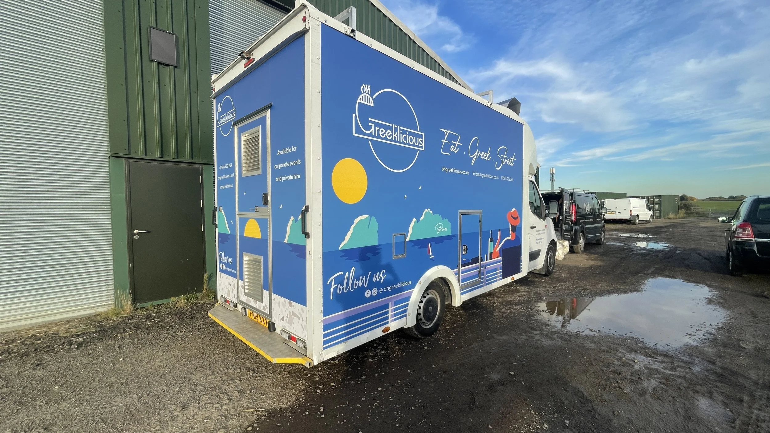 Rear and side view of Oh Greeklicious catering truck with full printed vehicle wrap.JPG