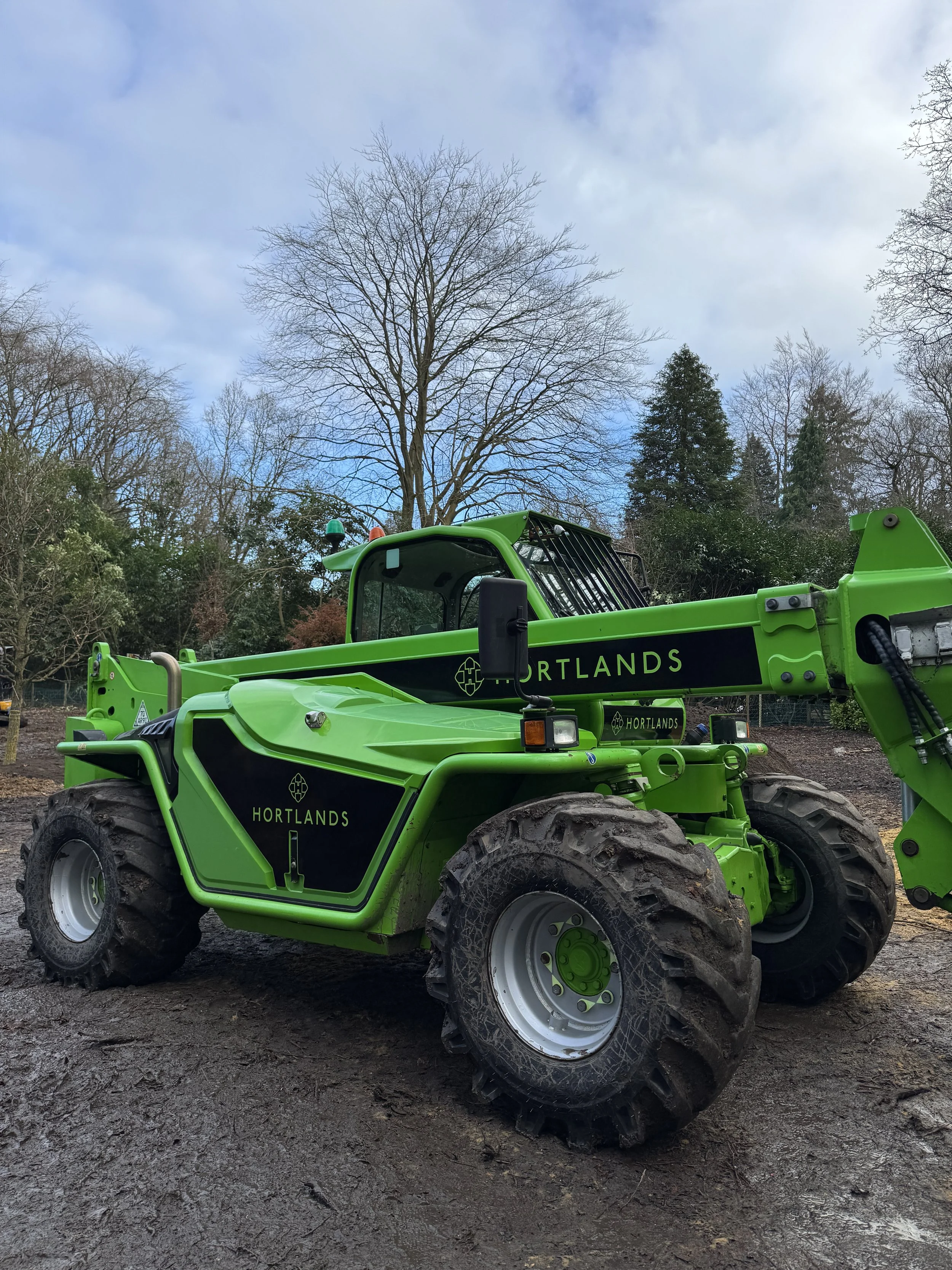 Branded telescopic handler featuring custom-cut Hortlands vinyl decals on boom and side panels.JPG