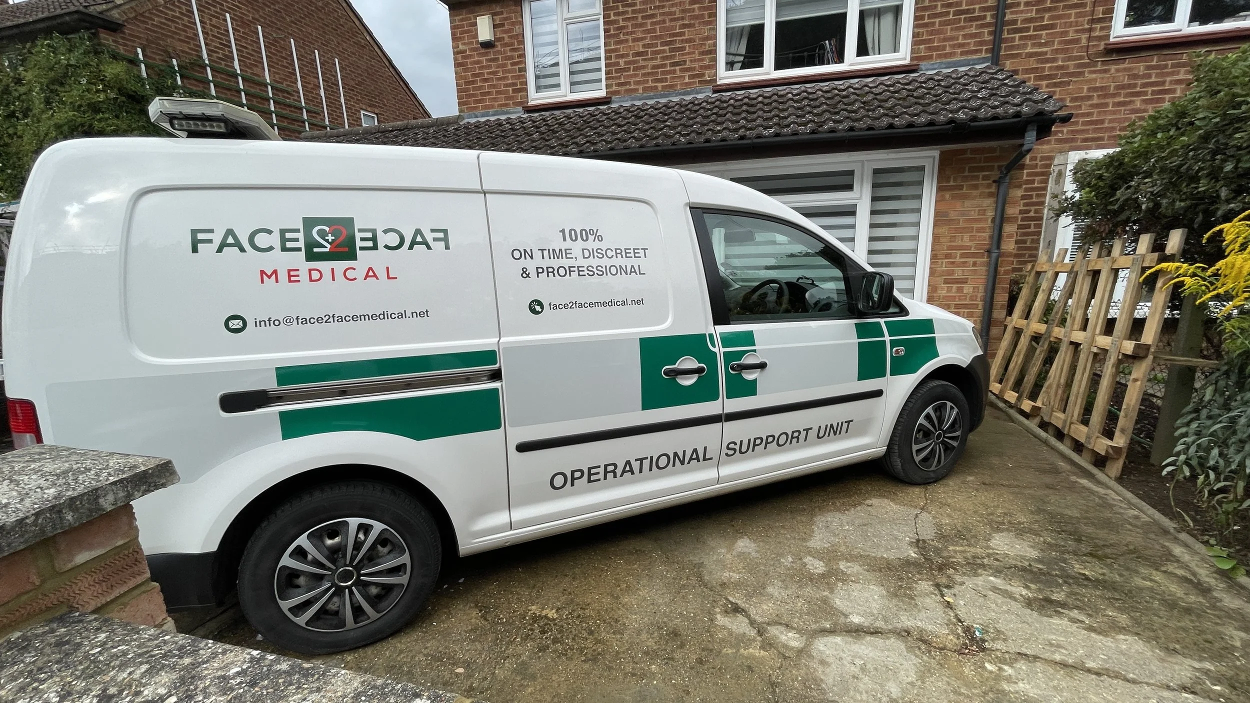 Custom medical van signage with printed green and grey vinyl graphics and operational support unit lettering.JPG