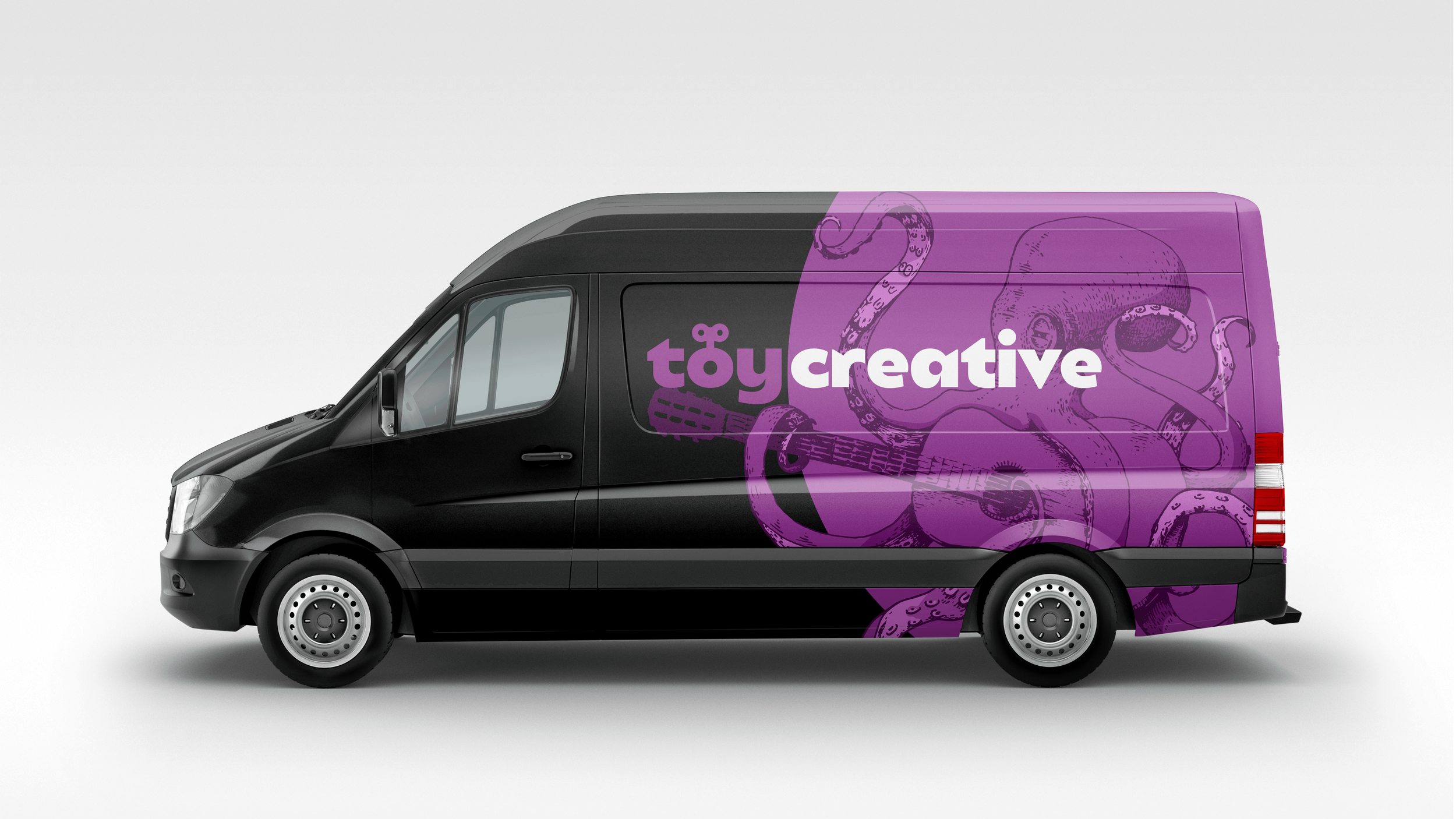 Black delivery van with purple graphic design featuring tentacles and the words 'toy creative' on the side.
