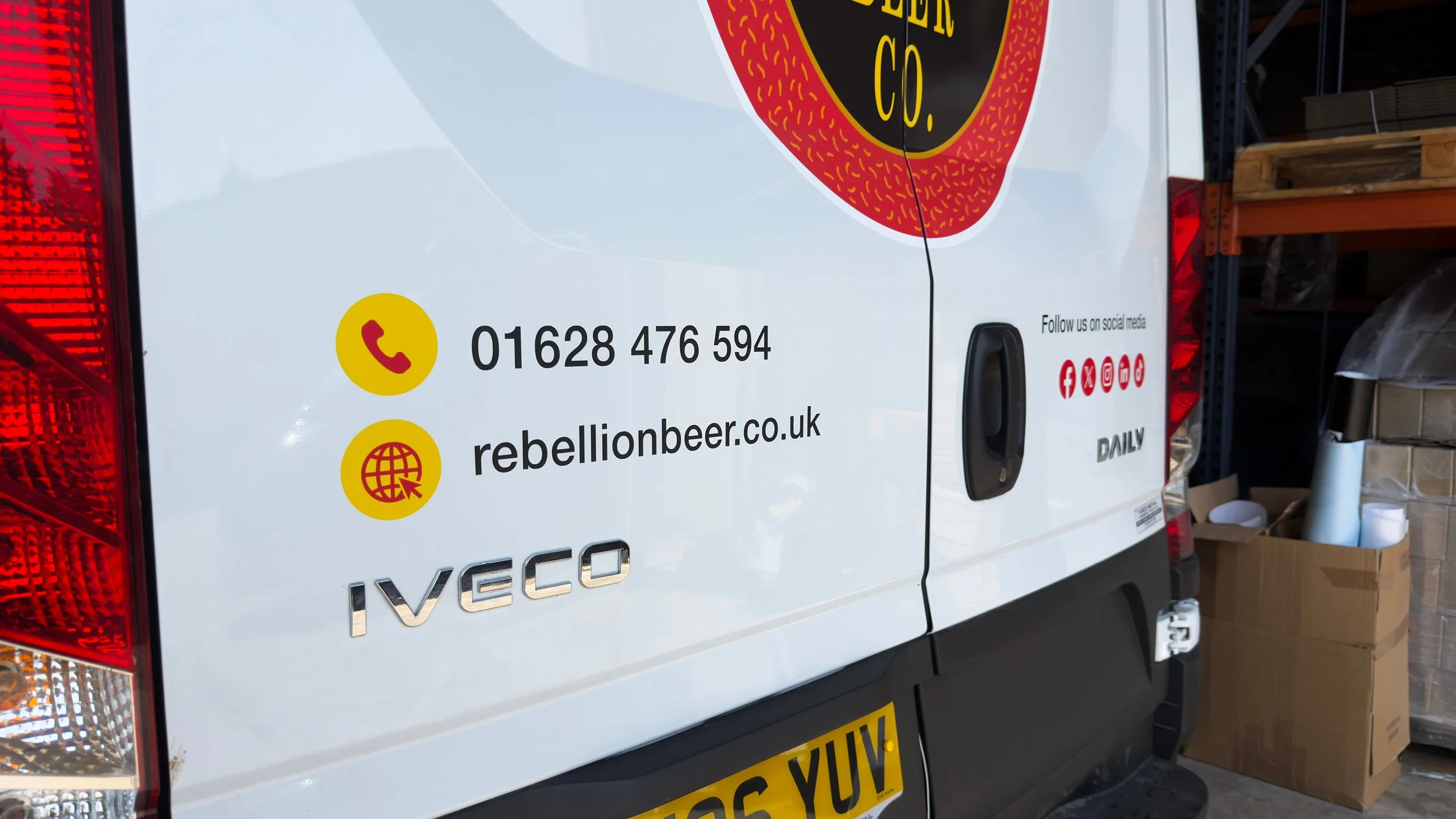 Social media vinyl decals on back of Rebellion Beer Van.jpg