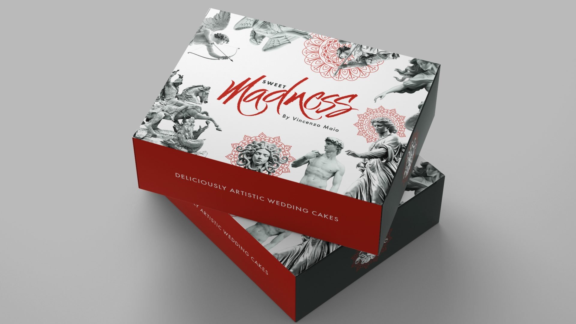 A box of wedding cakes decorated with artwork inspired by classical sculptures and classical themes.