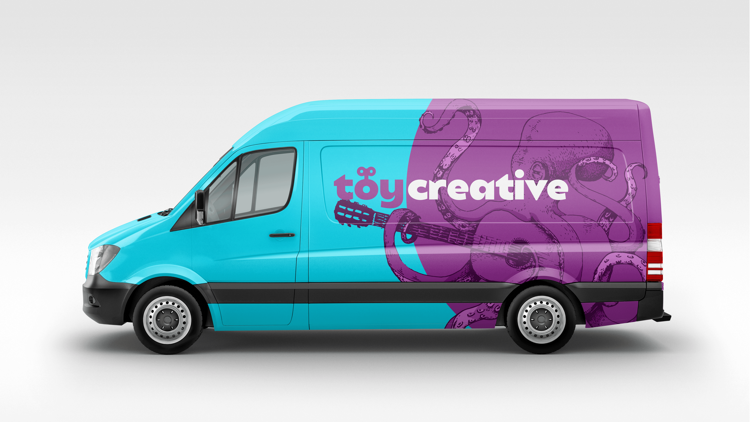 A delivery van with a two-tone blue and purple design featuring an octopus illustration and the text 'toy creative' on the side.