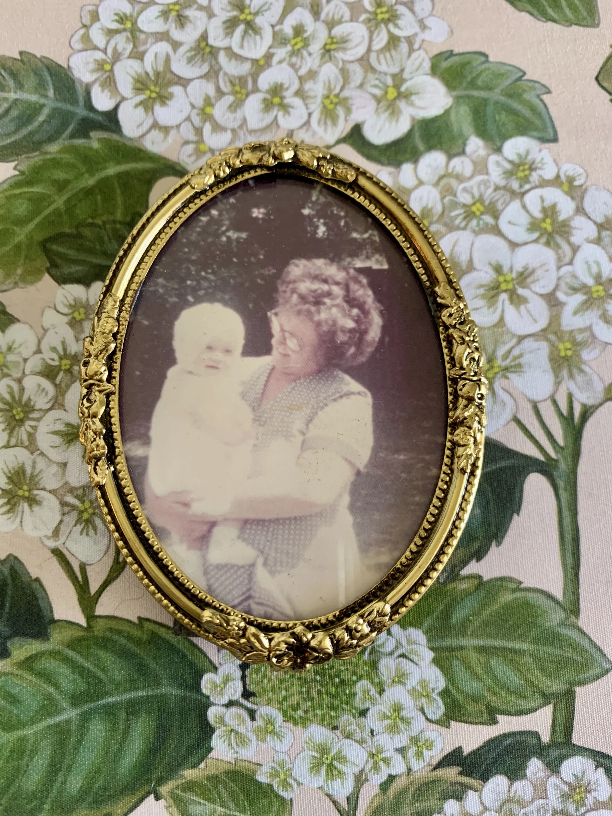 Nanna Beryl holding me as a baby in the back gardens at Britannia Avenue